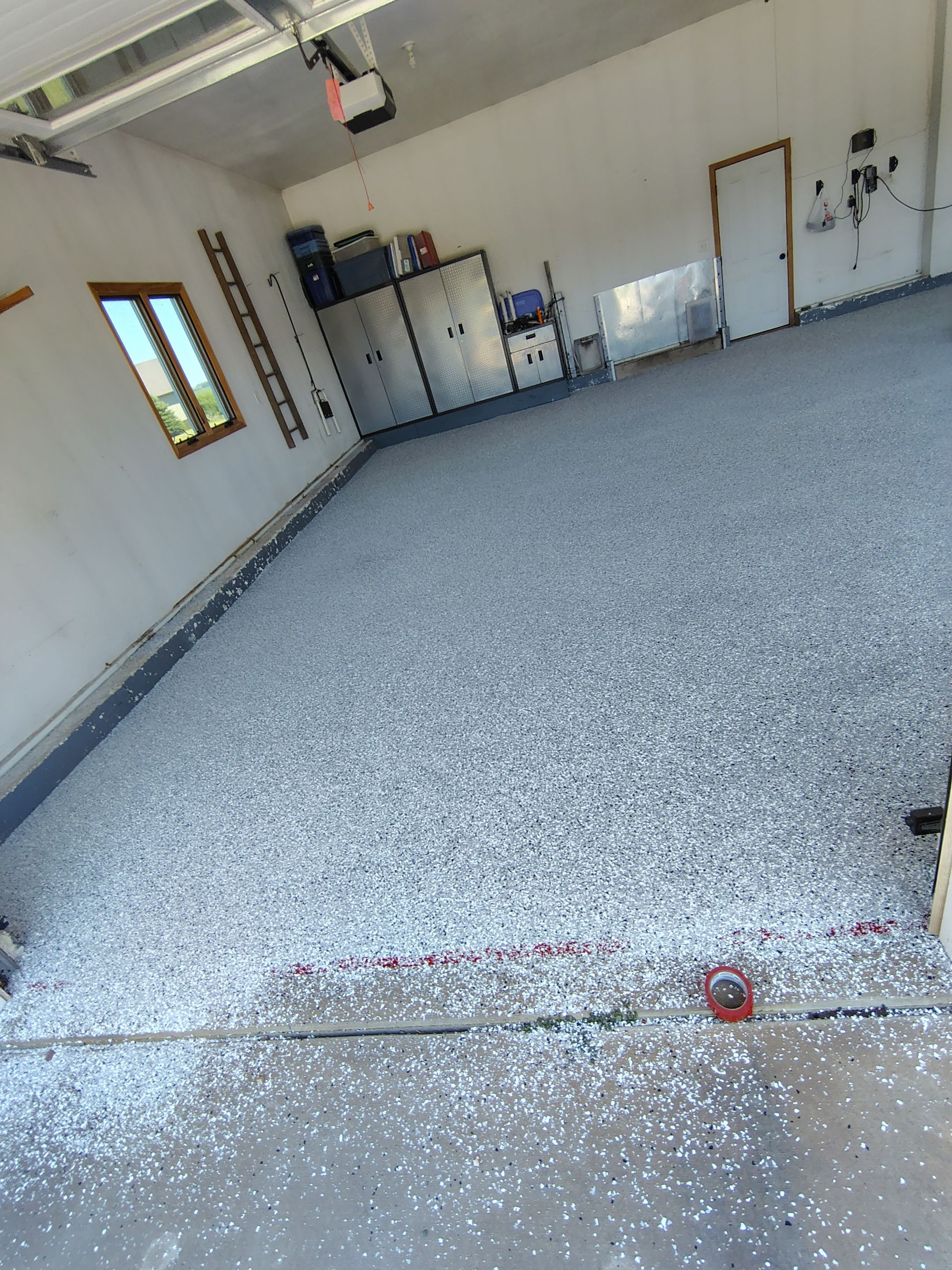 Feather Grey Garage Floor Coating Installation in Valley Springs by Select Painting, Coatings & Garage Cabinets