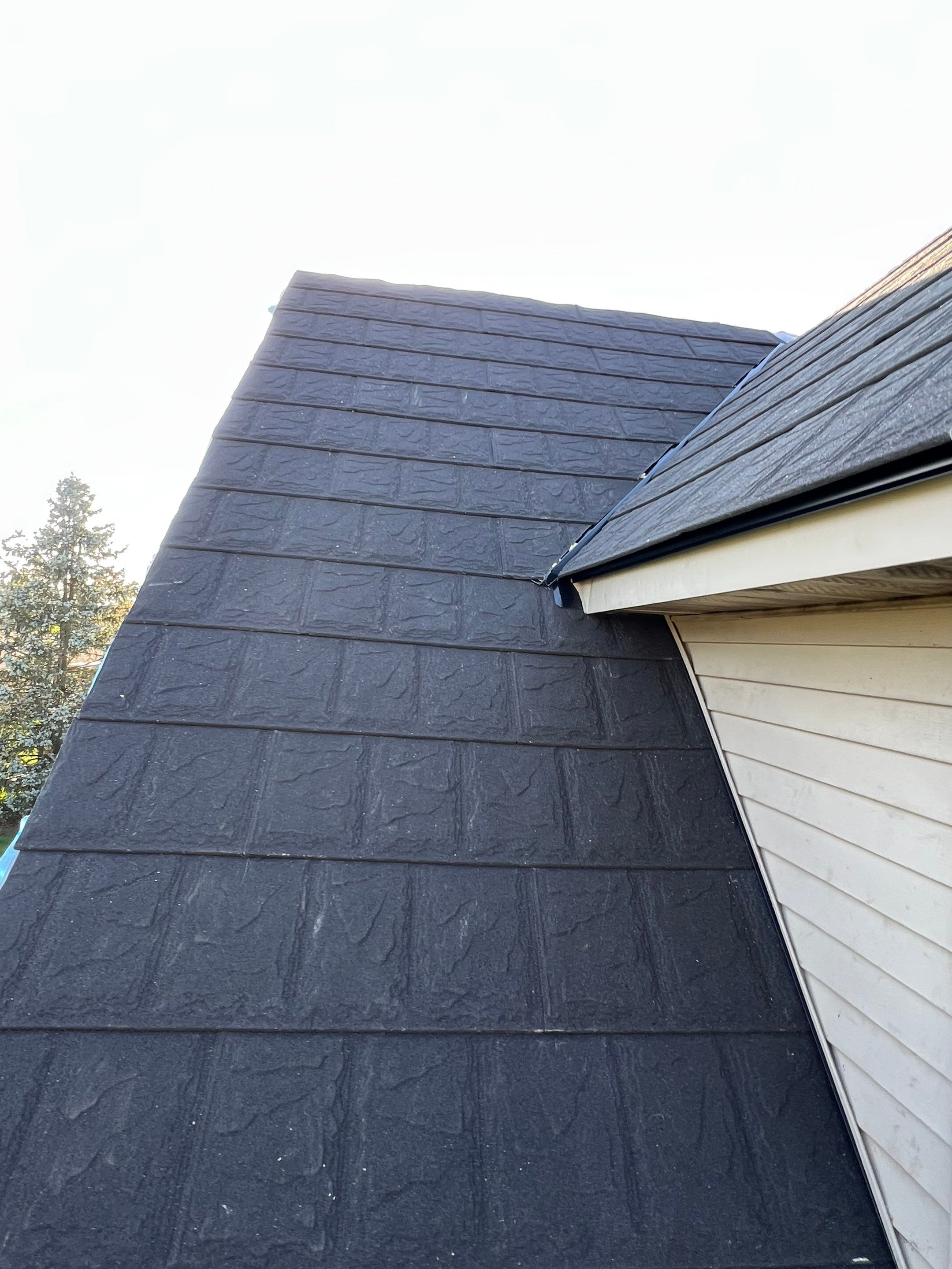 Residential Roofing Repair using Metstar Stone Coated Charcoal by Nitro Roofing and Construction