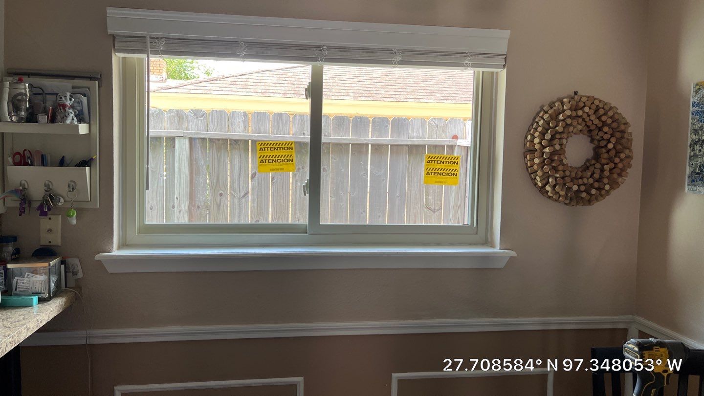 Colored Vinyl Windows to blend into brick by Bayfront Roofing and Construction