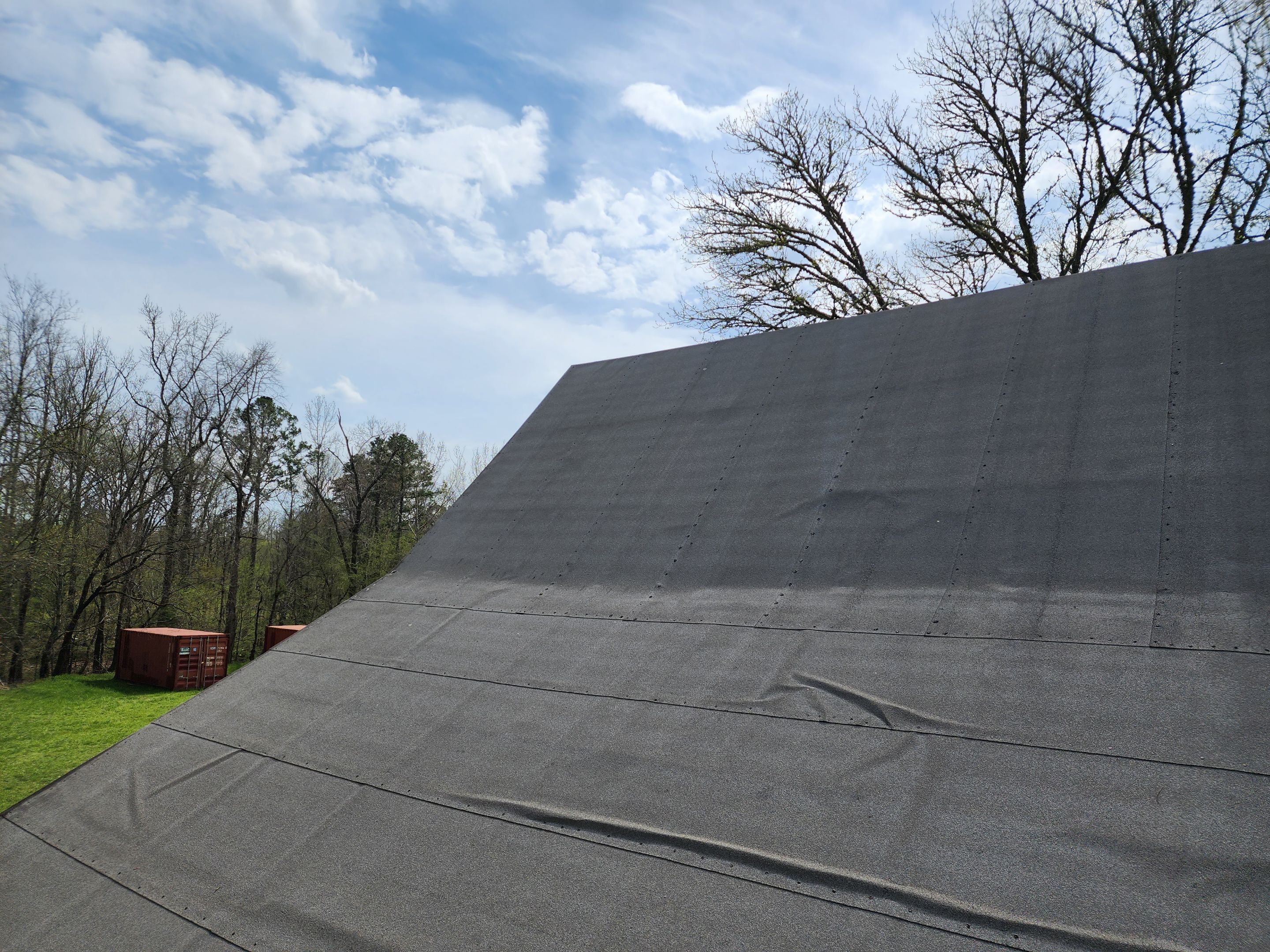 Residential Roofing Installation using 26 Gauge Colored Panels by Hostetler Roofing