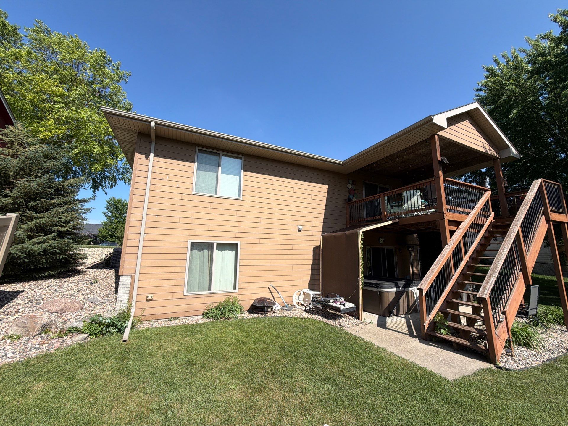 Full Exterior Residential Painting and Siding Refresh in Tea by Select Painting, Coatings & Garage Cabinets