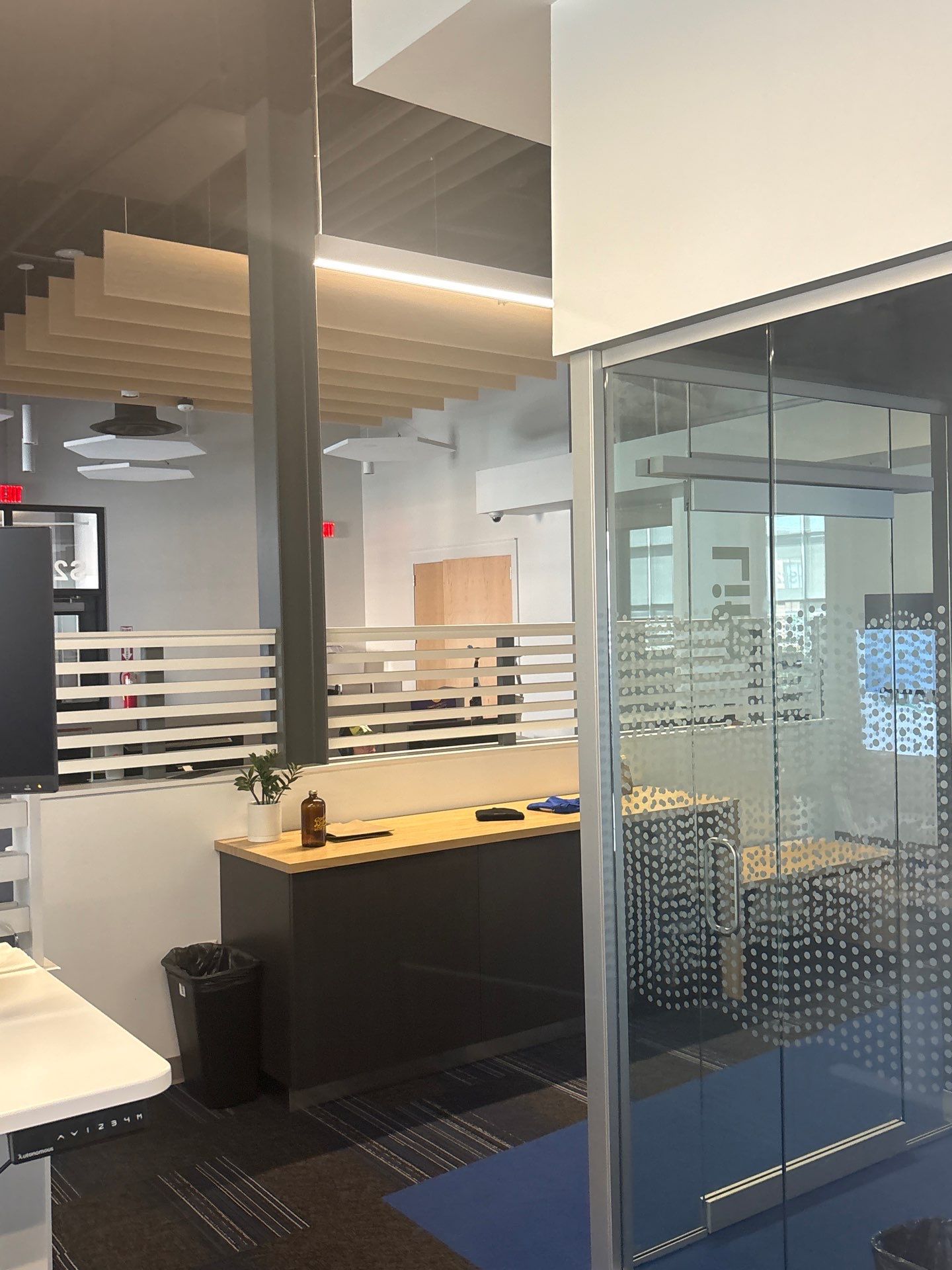 Lincoln Office Interior Remodel with Acoustic Baffles and Glass Walls by CompanyCam Sales Demo