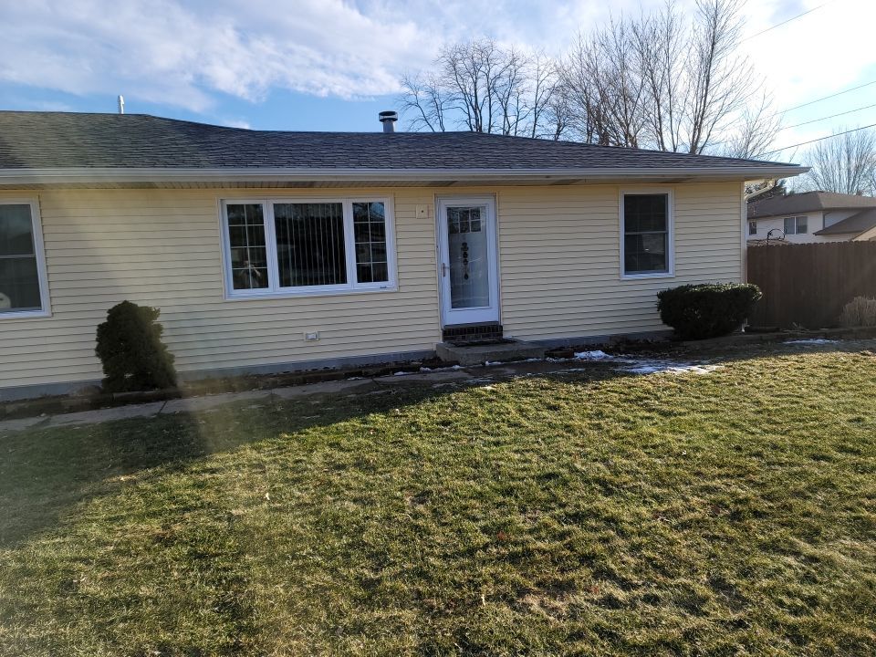 taking down brick wall & installing siding by Kraz Construction