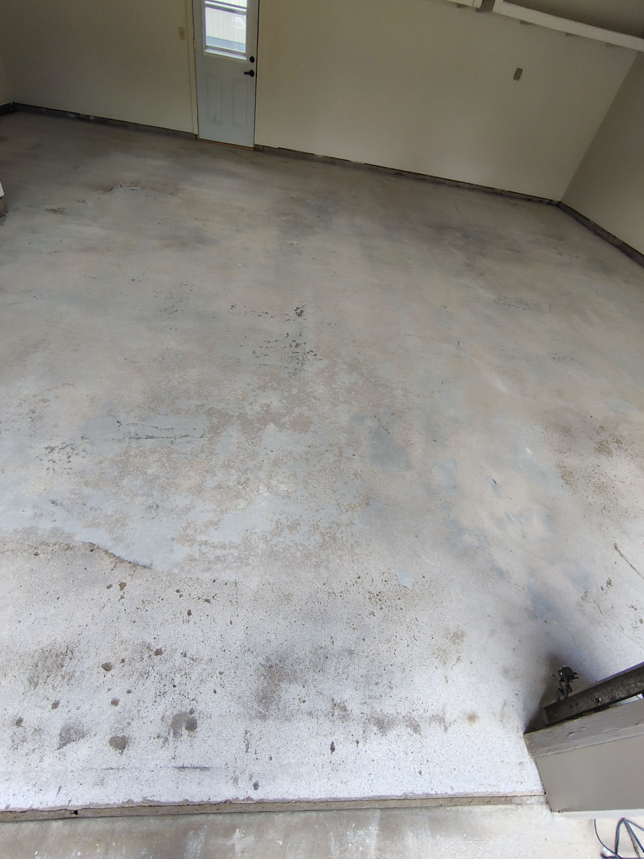 Full-Flake Epoxy Garage Floor Coating Installation in Sioux Falls by Select Painting, Coatings & Garage Cabinets