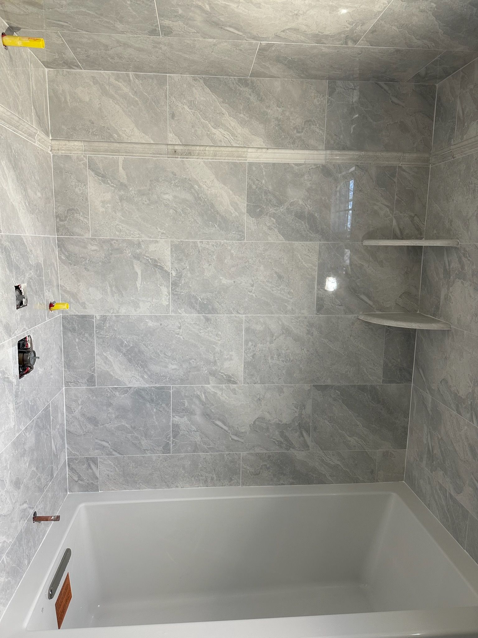 Bathroom Remodel using Porceline Tile from The Tile Shop by Footprints Floors Morristown