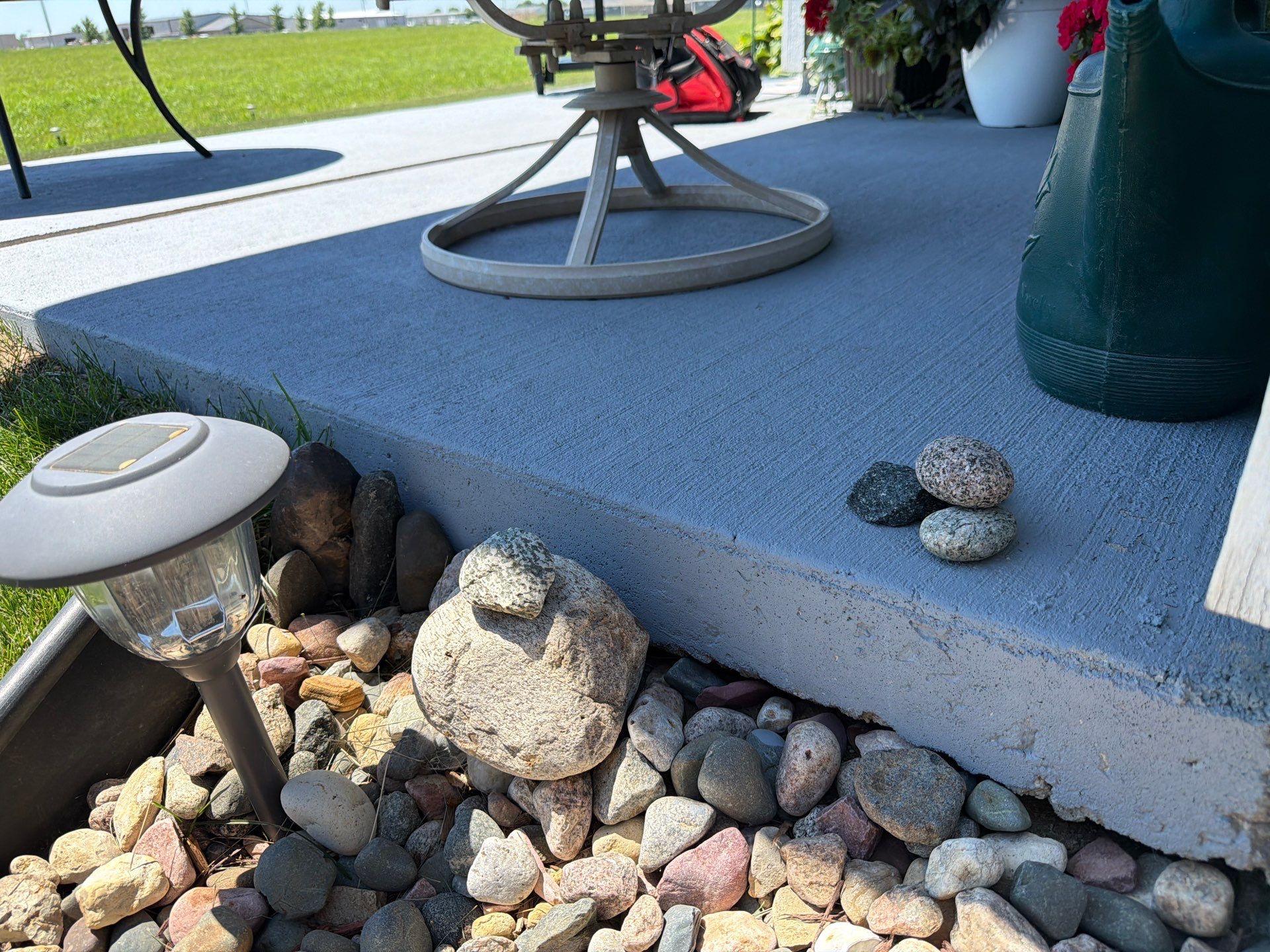 Starry Evening Concrete Patio Coating Installation in Tea by Select Painting, Coatings & Garage Cabinets