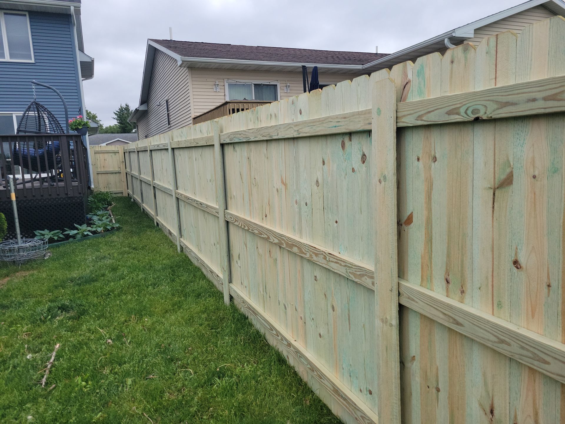 Pressure-Treated Wood Privacy Fence Installation in Waterloo by Perfect Picket Fence and Stain