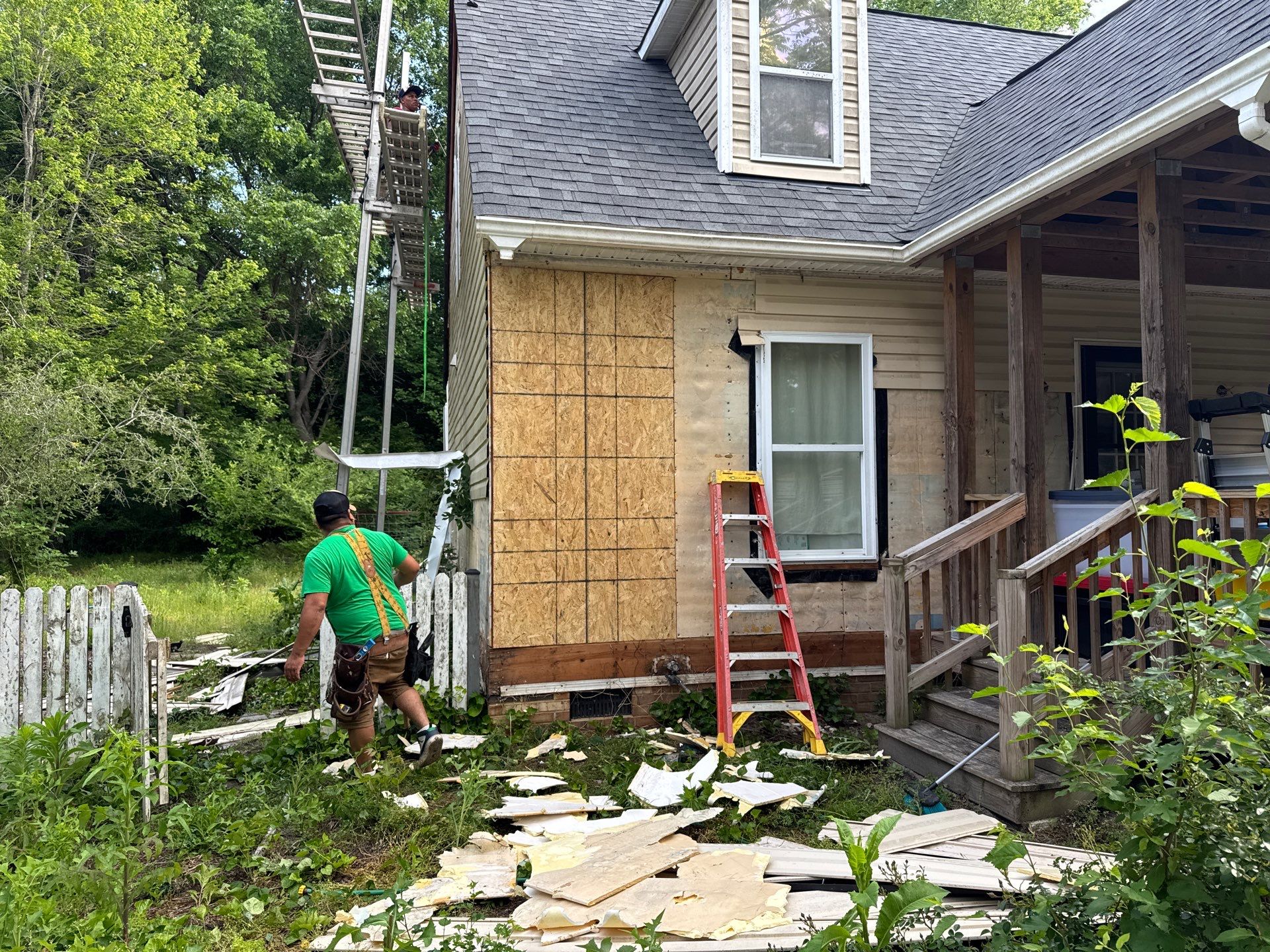 Gloucester Exterior Overhaul with Navy Blue Siding and New Roof by Cade Construction
