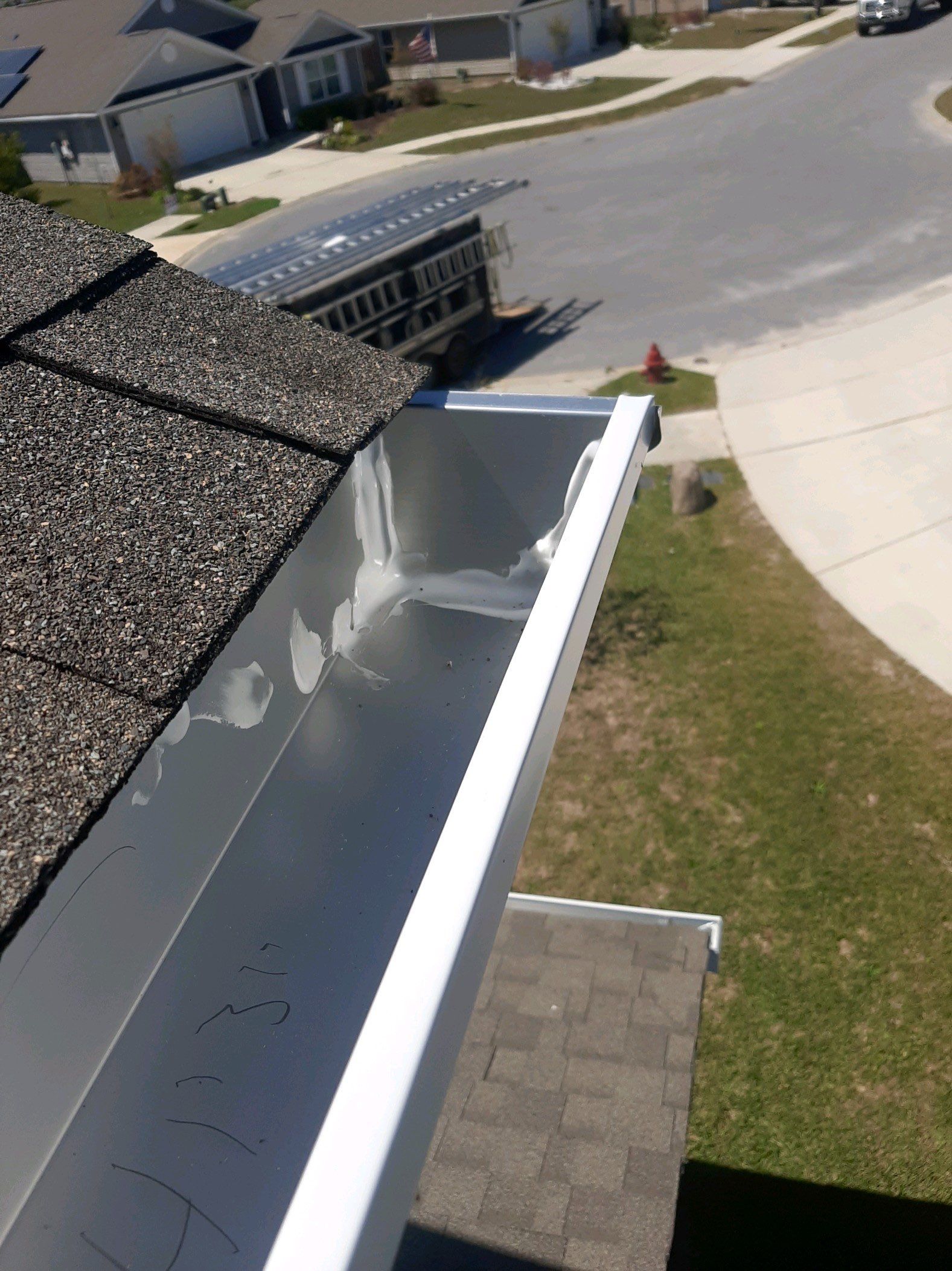 Gutter Installation Using White K-Style Seamless Gutters by Gutter Professors