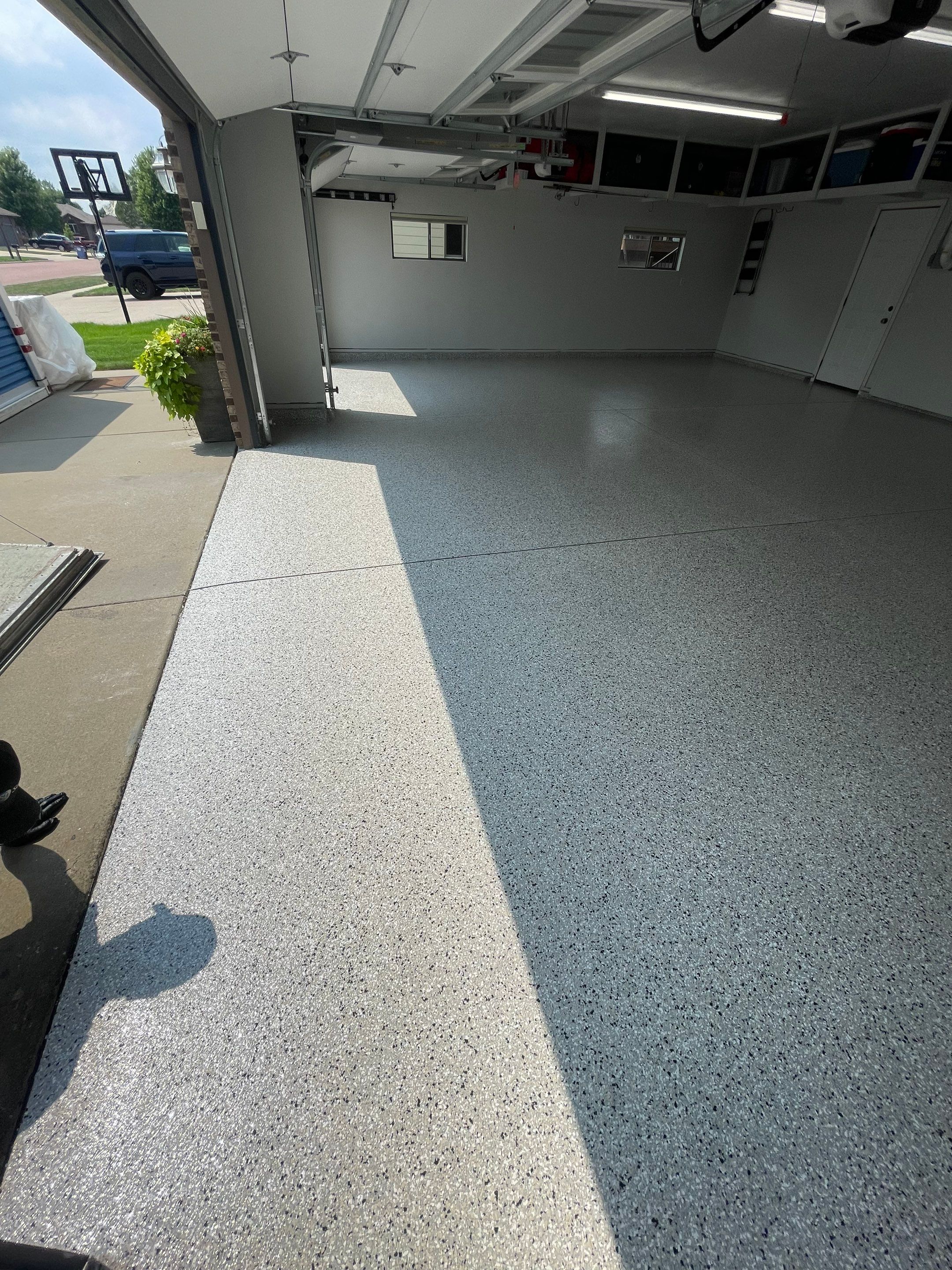 Multi-Car Garage Floor Coating and Crack Repair in Tea by Select Painting, Coatings & Garage Cabinets