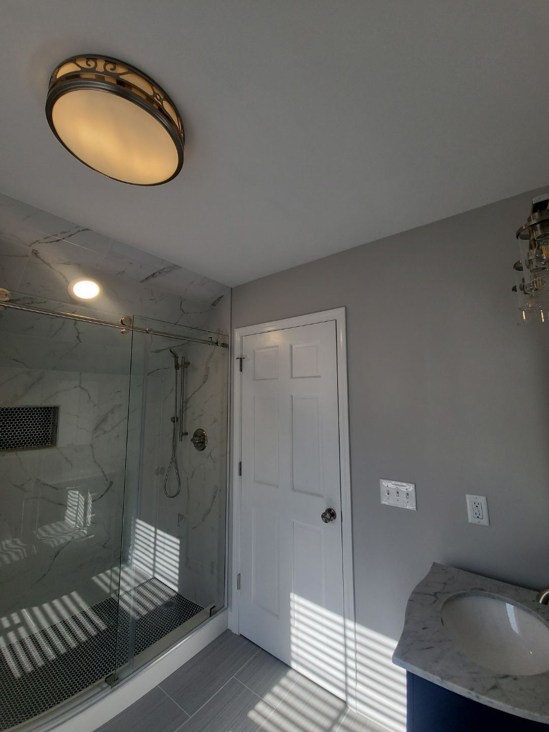 From Rafters to Retreat: An Attic Transformed with a Luxe Bath Escape by Elite Remodeling and Design LLC