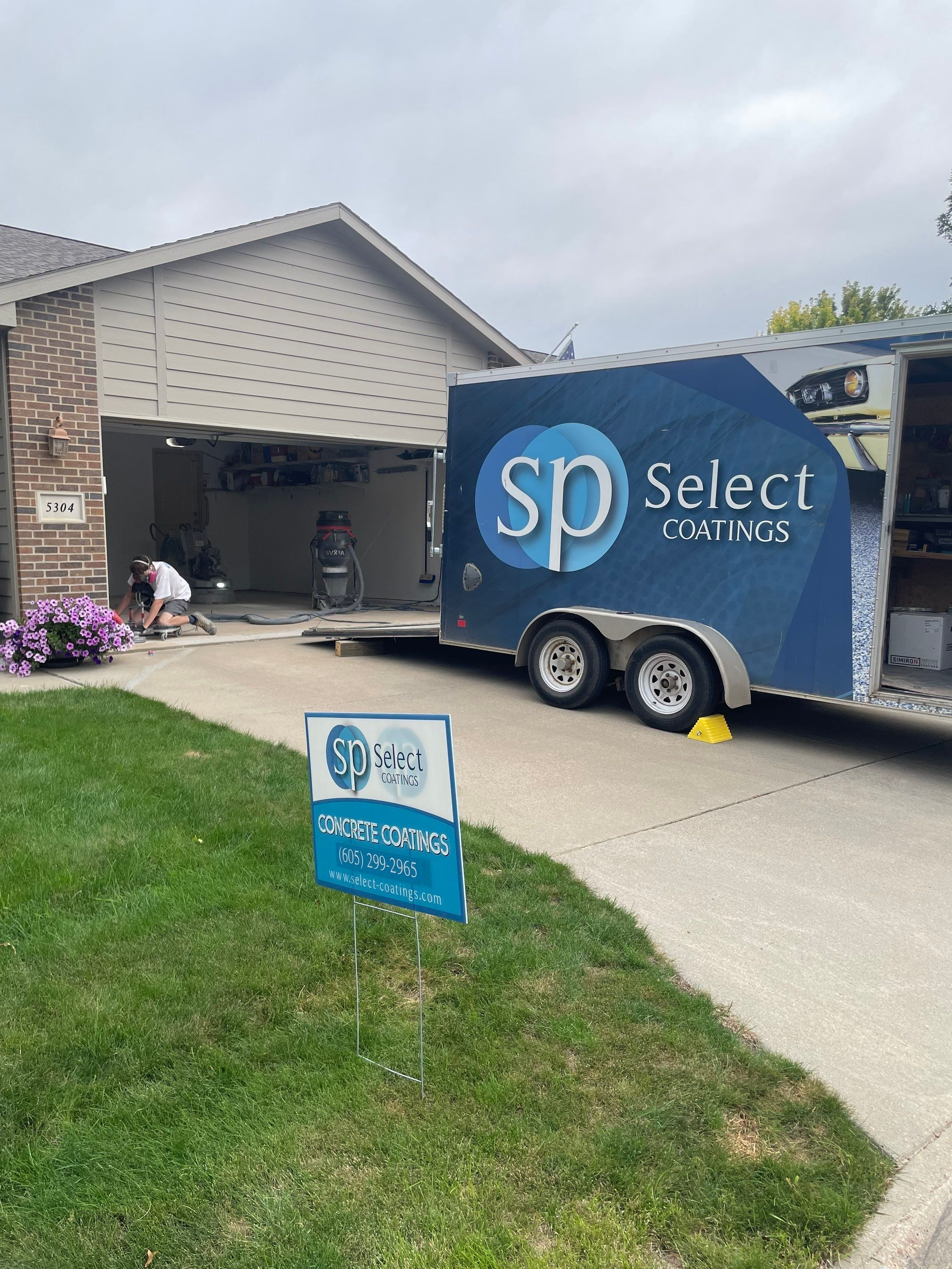 Sioux Falls Residential Garage Floor Coating with Speckled Epoxy Finish by Select Painting, Coatings & Garage Cabinets