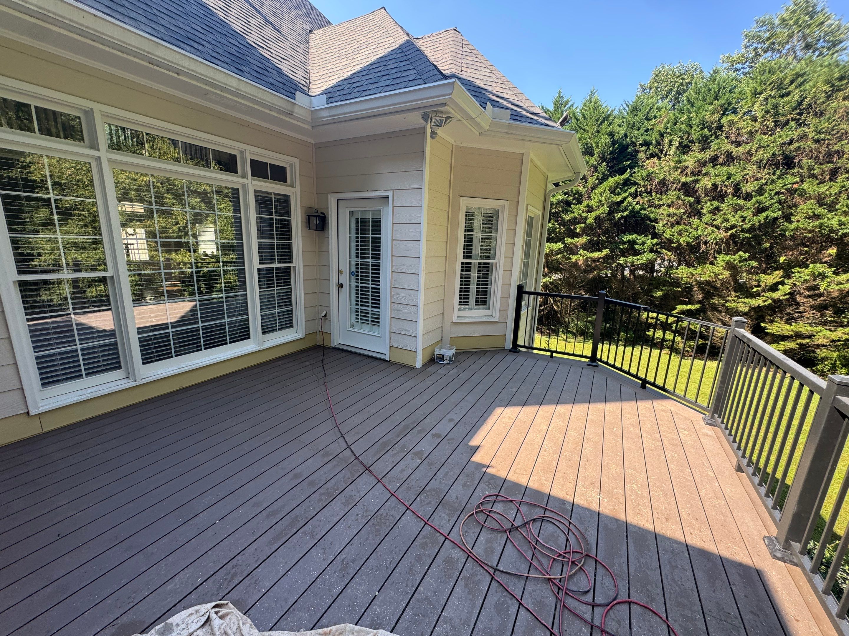 Elevated Composite Deck Replacement with Metal Railings in Smyrna by Swift Home Renovations 