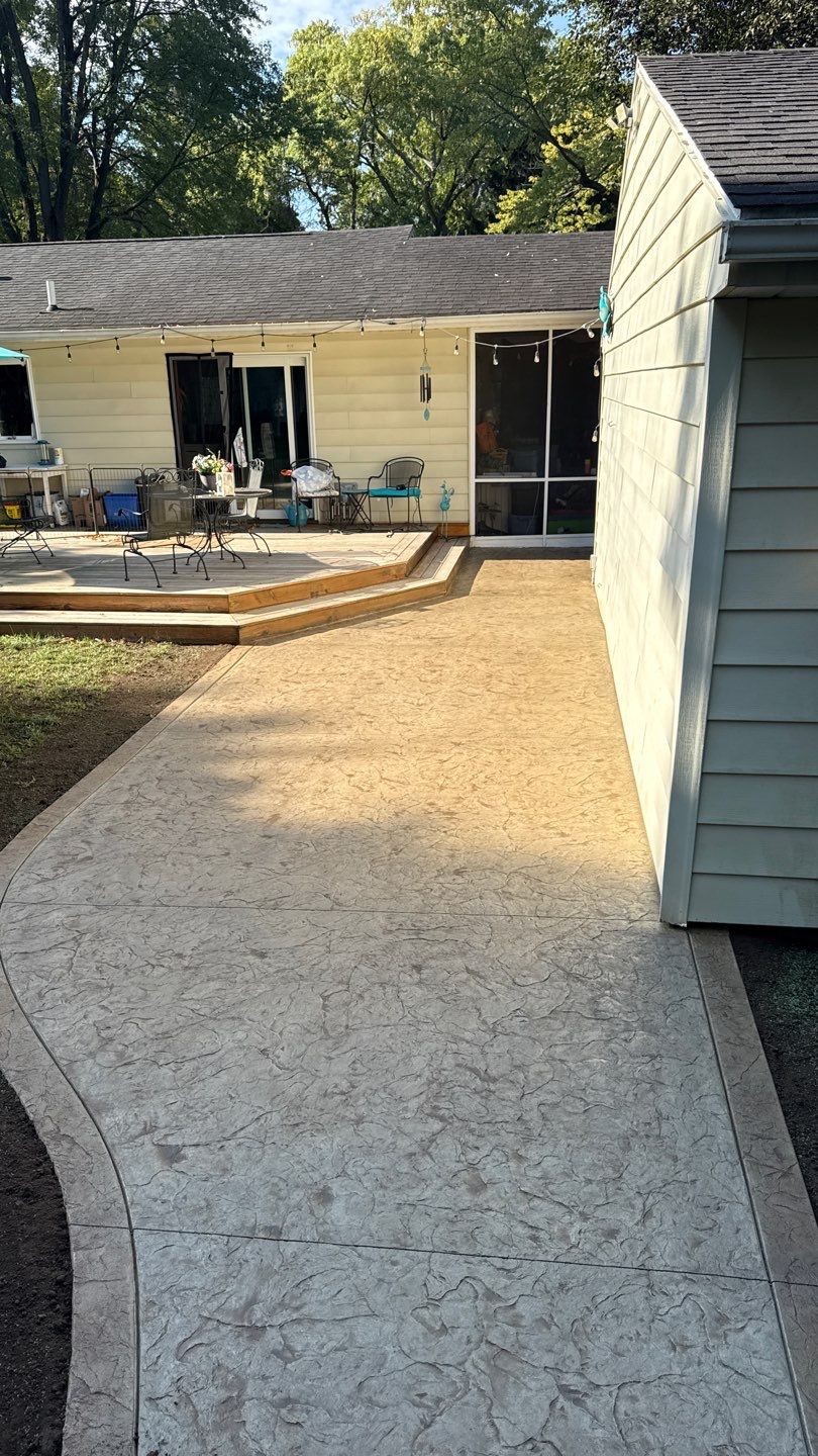 Oxford slate stamped patio  by NG Masonry & Construction LLC