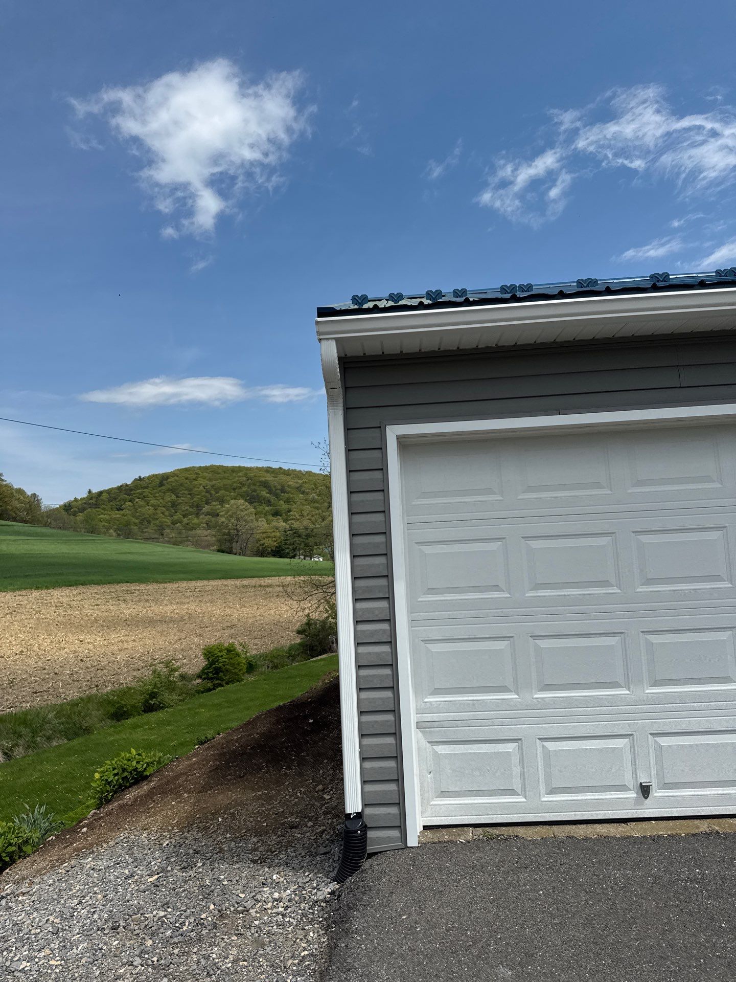 3-Car Garage refresh Blue Metal Roofing in Herndon by Esh Builders