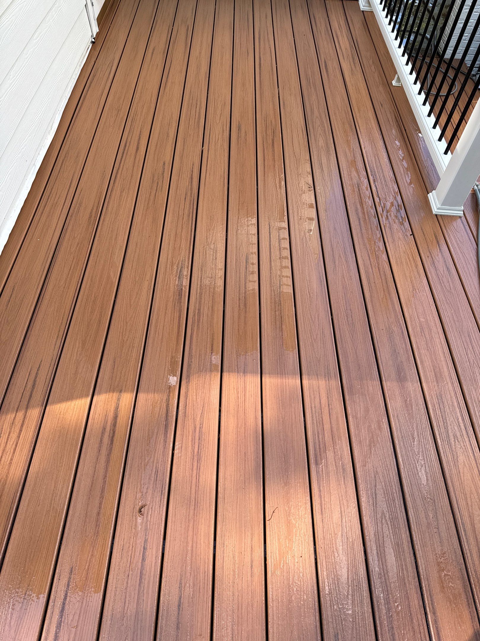 cleaning and restoring a wooden deck and possibly railing through pressure washing