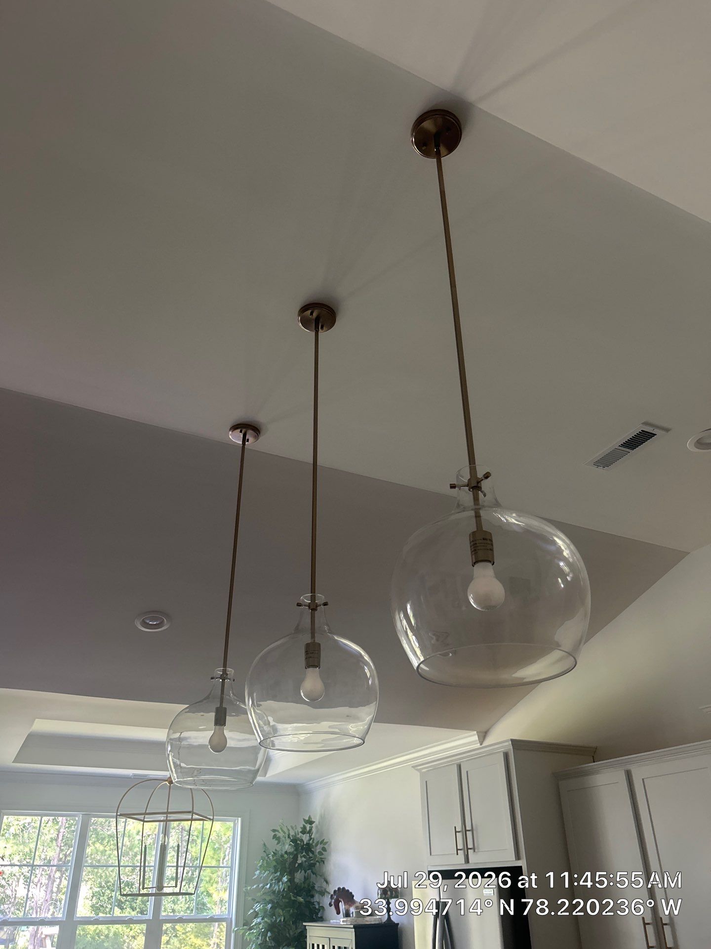 Bolivia Entry Door Upgrade and Modern Pendant Light Installation by RGR Construction and Roofing, LLC