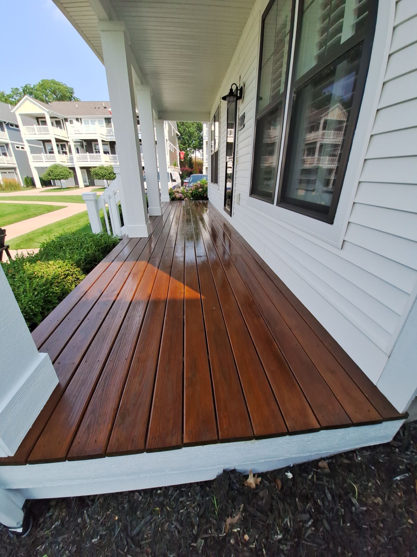 Freshly Stained Deck with Painted Railings by Gordon Painting