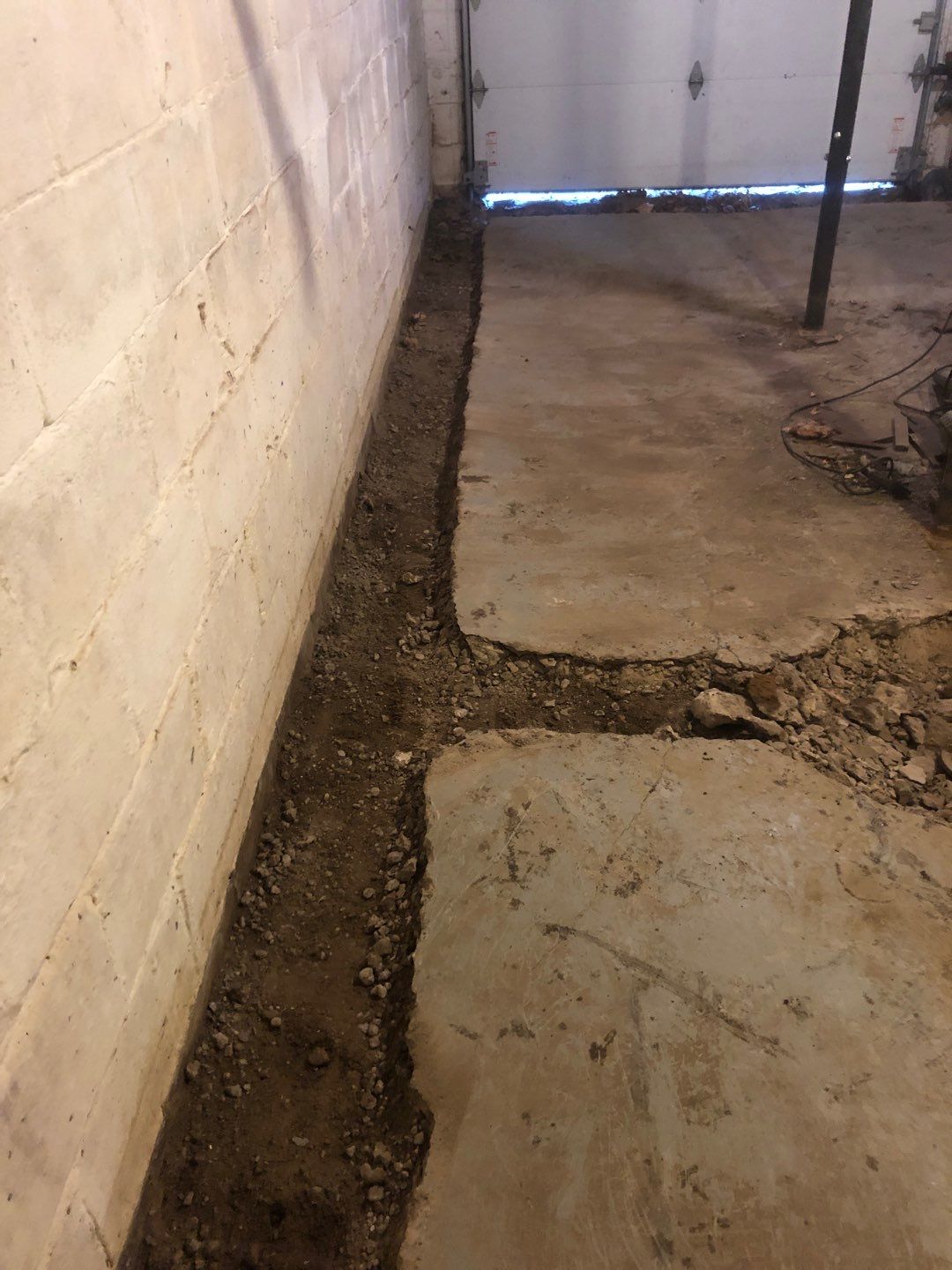 Basement Waterproofing using Drain tile system and a foundation wrap by ACE Waterproofing & Basement Solutions