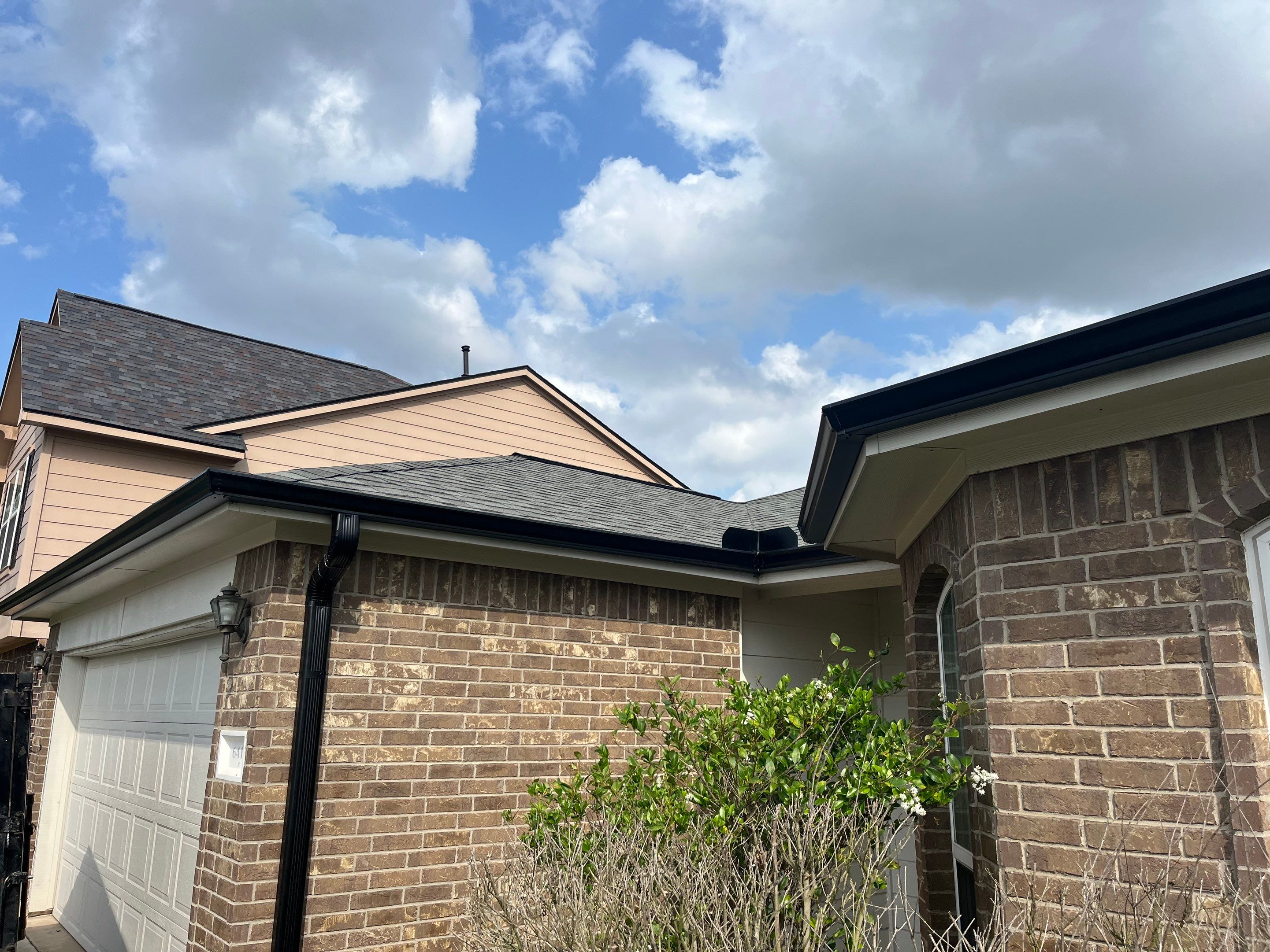Reroof and Gutter Project in Houston by Roofing Technologies Unlimited