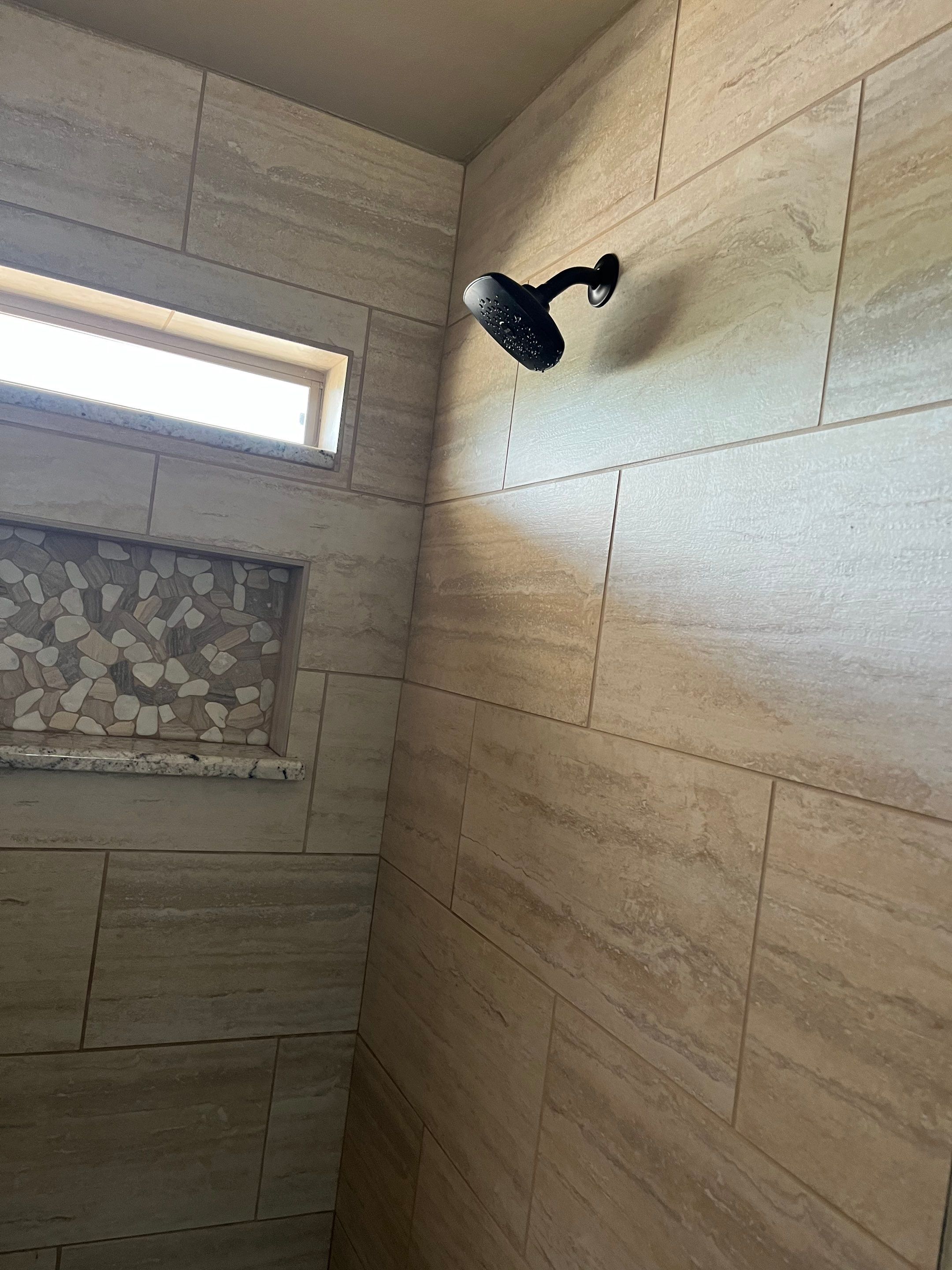 Bathroom Shower Remodel for a client by First United Roofing & Construction