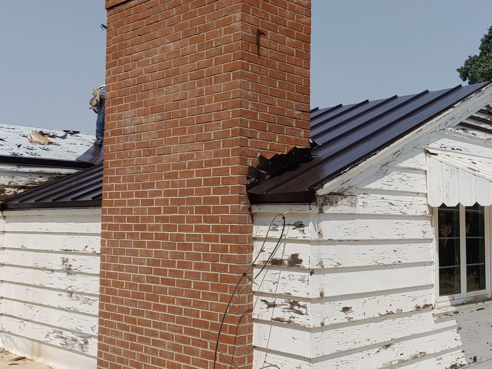 Residential Roofing Installation using Standing seam metal roofing system by Straight Edge Roofing Inc