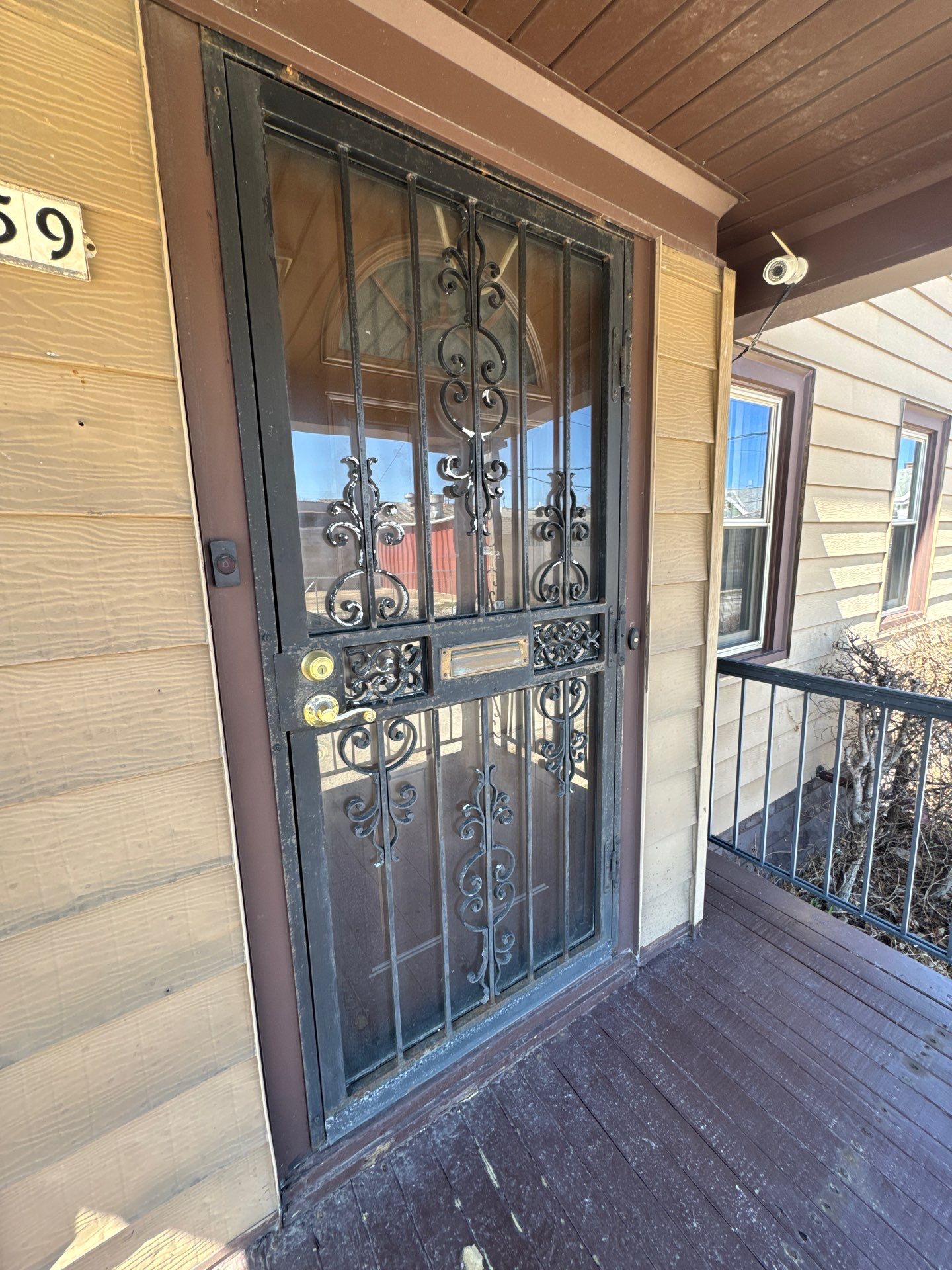 Milwaukee Exterior Porch Refinishing and Security Door Installation by OCS Contracting Services
