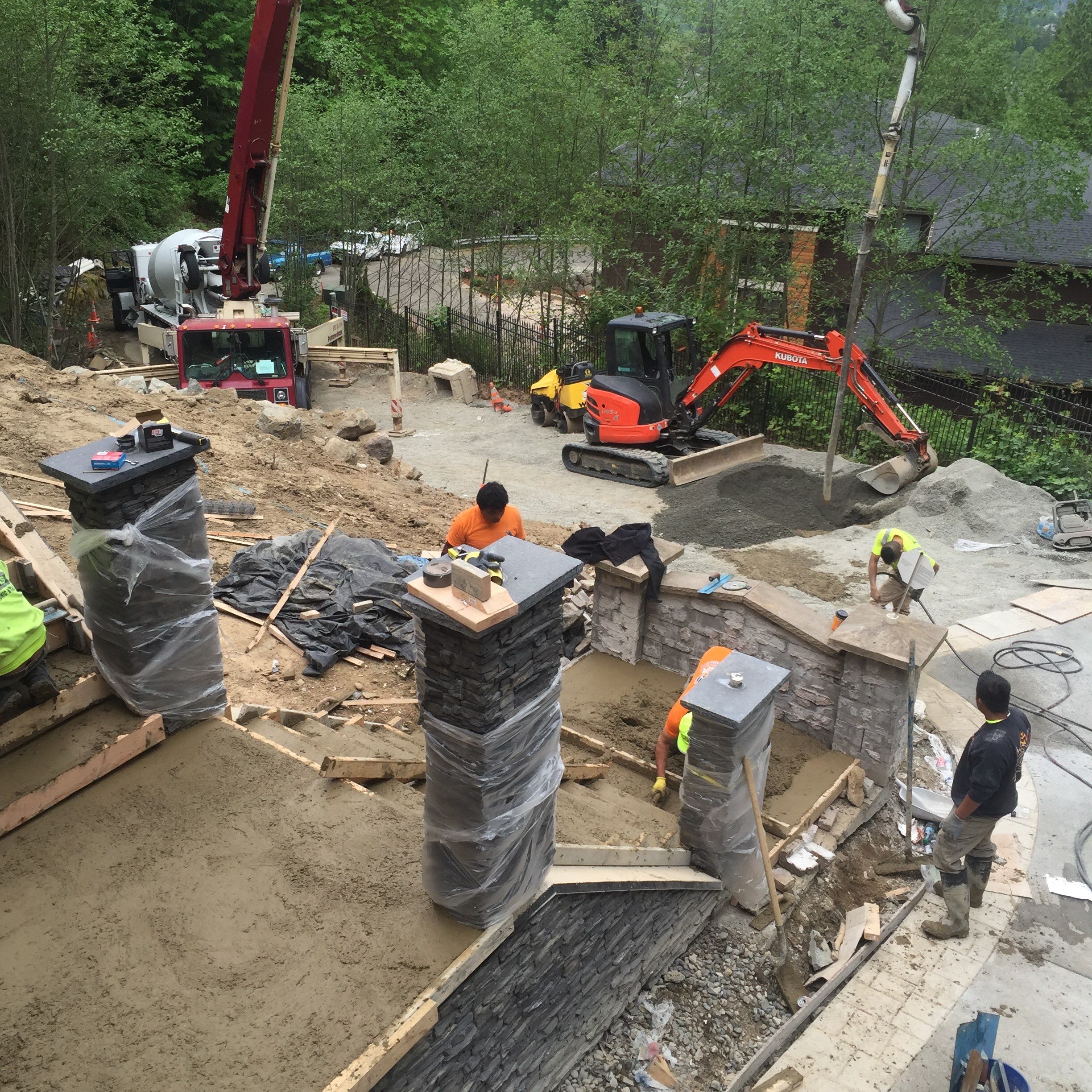 Asphalt Driveway and Stamped Concrete Patio Finish  by Jireh Asphalt & Concrete Inc 