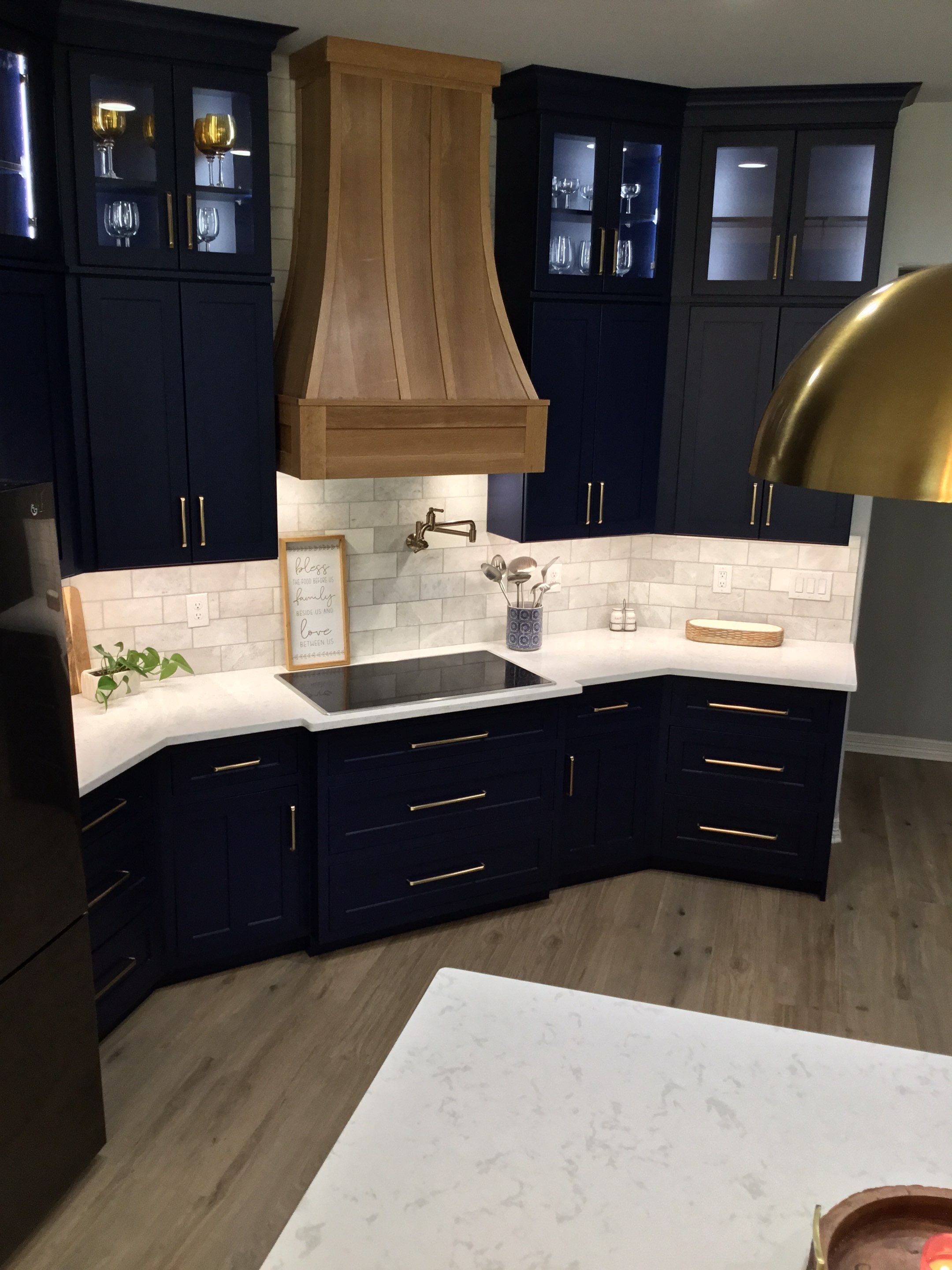 Spring Branch Kitchen Remodel | Custom Navy Cabinetry & Wood Range Hood by Legacy Bath and Kitchen