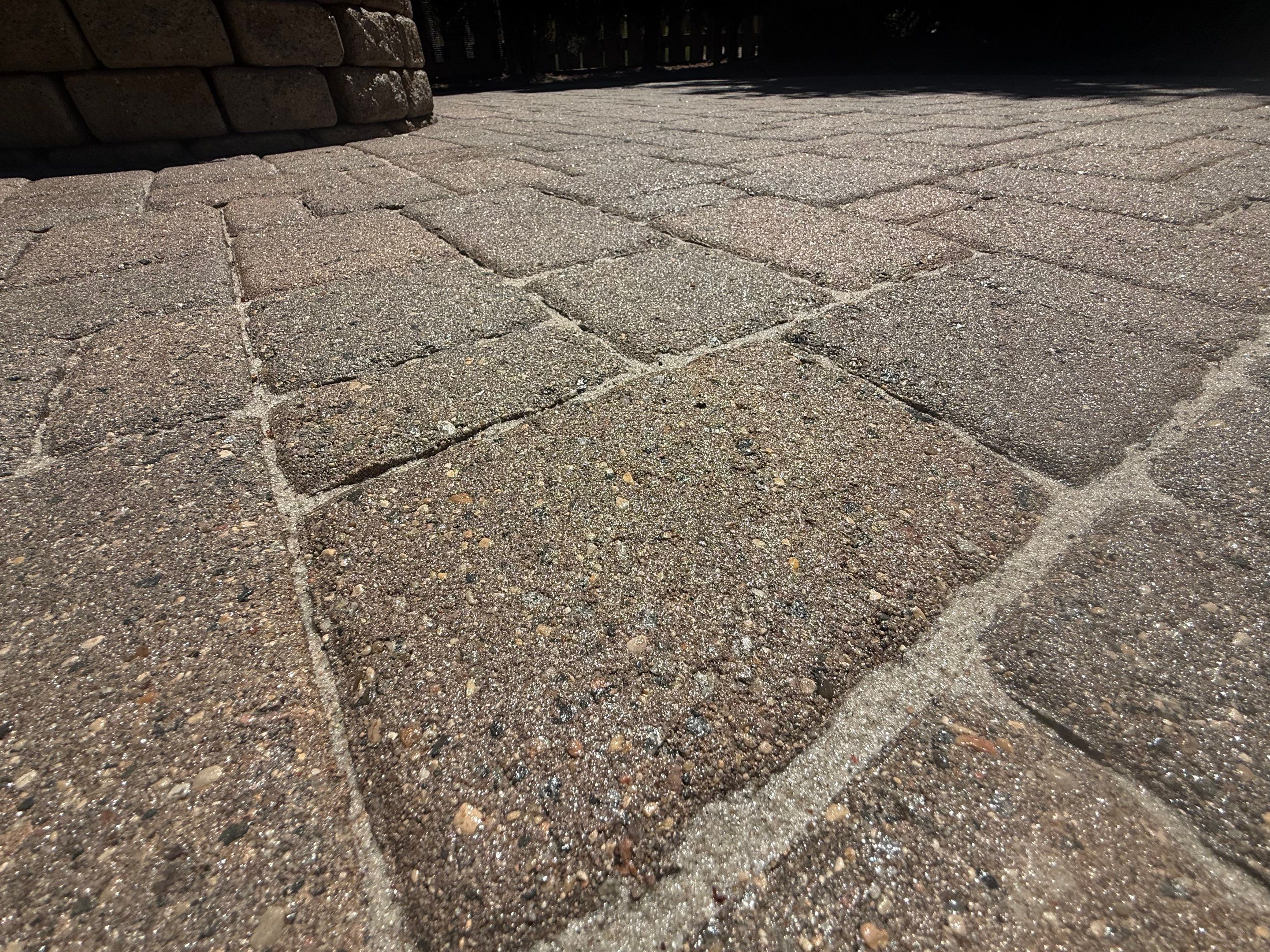 Textured Concrete Coating and Paver Patio Refresh in Sioux Falls by Select Painting, Coatings & Garage Cabinets