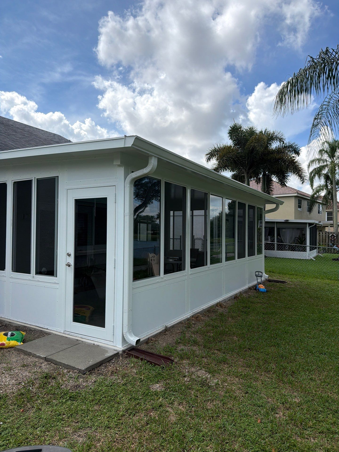 Custom Impact Sunroom With PGT Windows & Aluminum Insulated Roof in Boynton Beach by The Screen Depot, Inc