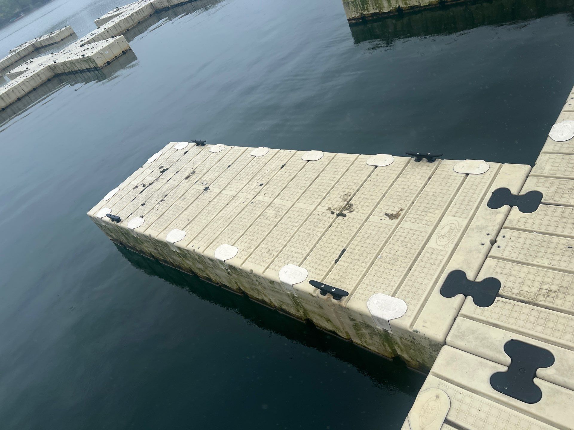 Power washing of floating dock by Northern Power Washing LLC.