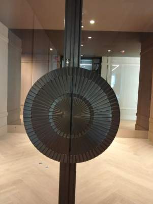 Modern Black Frame Double Door Installation with Custom Radial Hardware