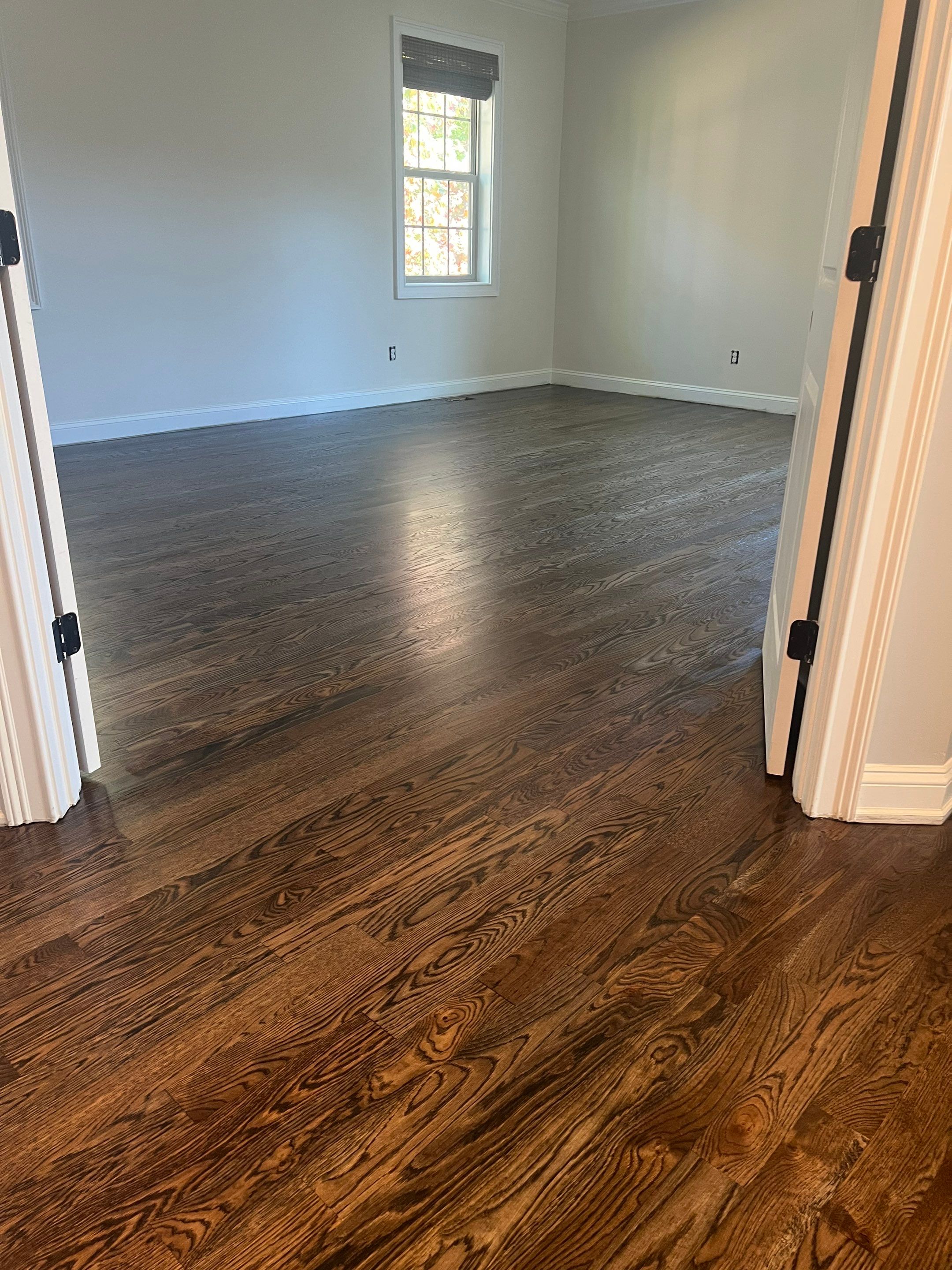 Adding hardwood floors to bedrooms by Accent Custom Floors