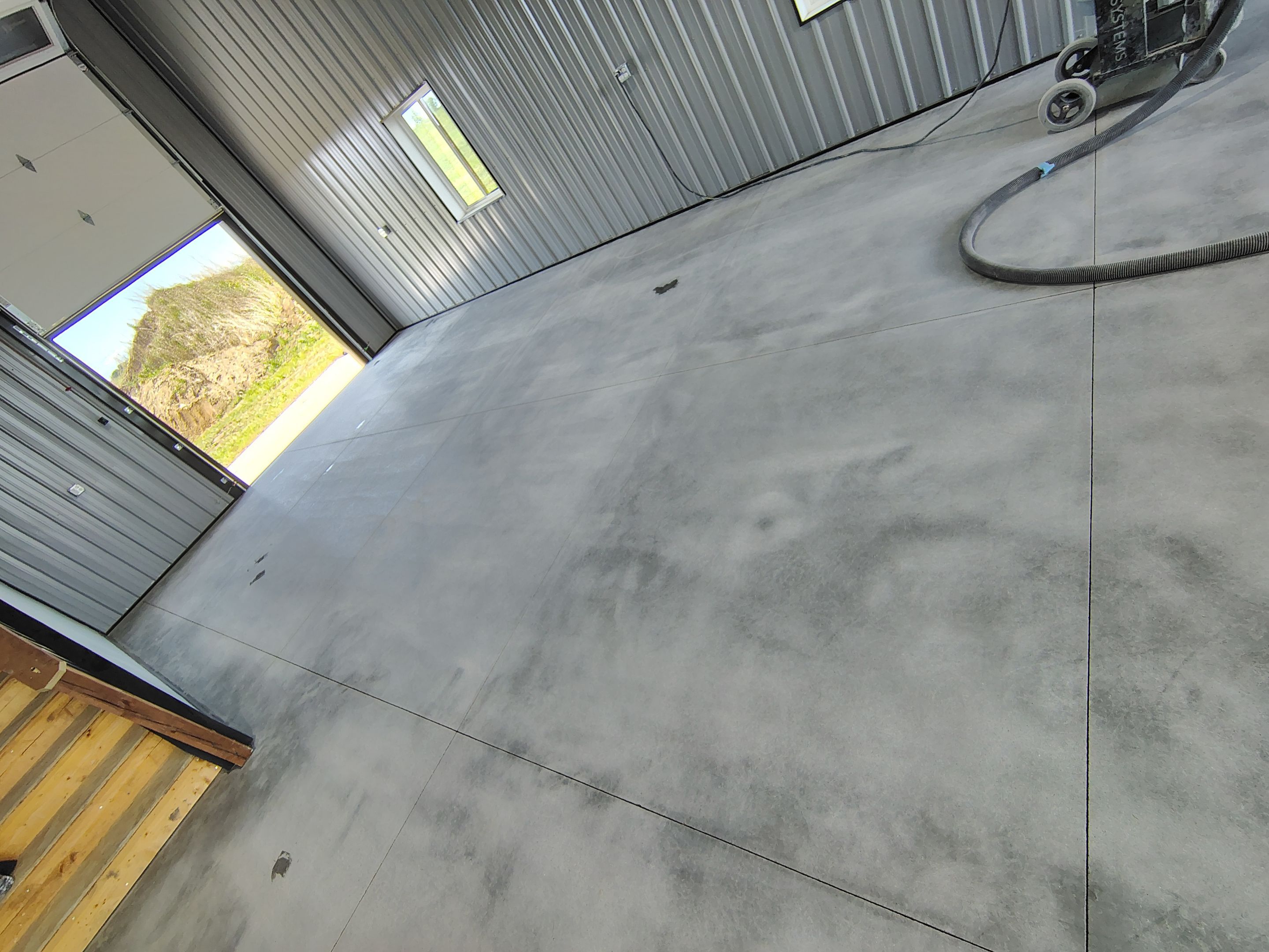 Polyaspartic Garage Floor Coating with Decorative Flake in Wentworth by Select Painting, Coatings & Garage Cabinets