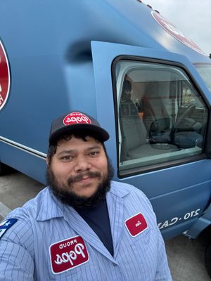 Taking Pride in our Work, Electrician Jose shows off his Clean Truck.