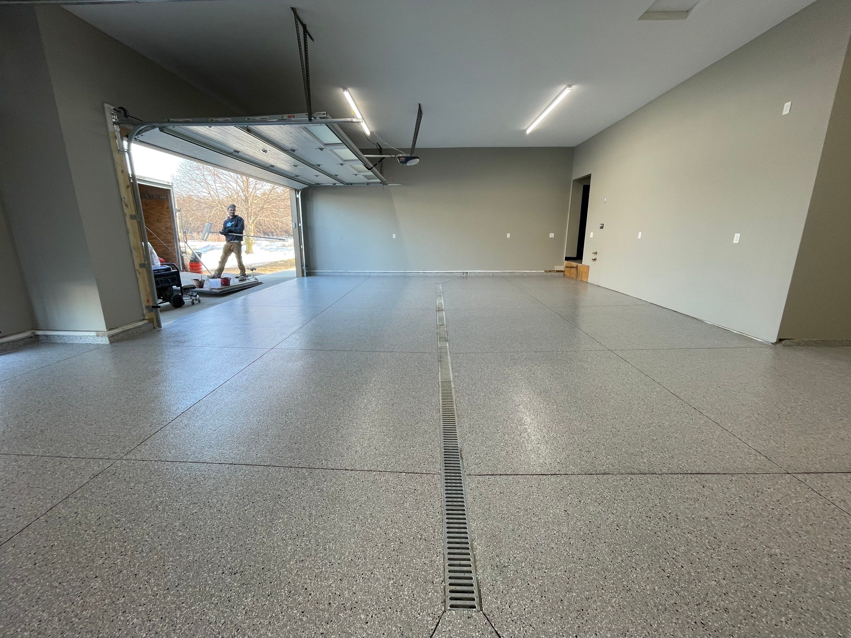 Decorative Flake Concrete Coating Installation in North Sioux City by Select Painting, Coatings & Garage Cabinets