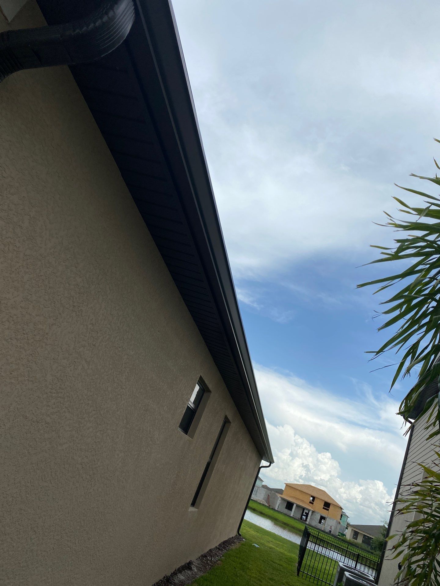 Brown Seamless Gutters for Homes in Fort Myers by Gutter Professors