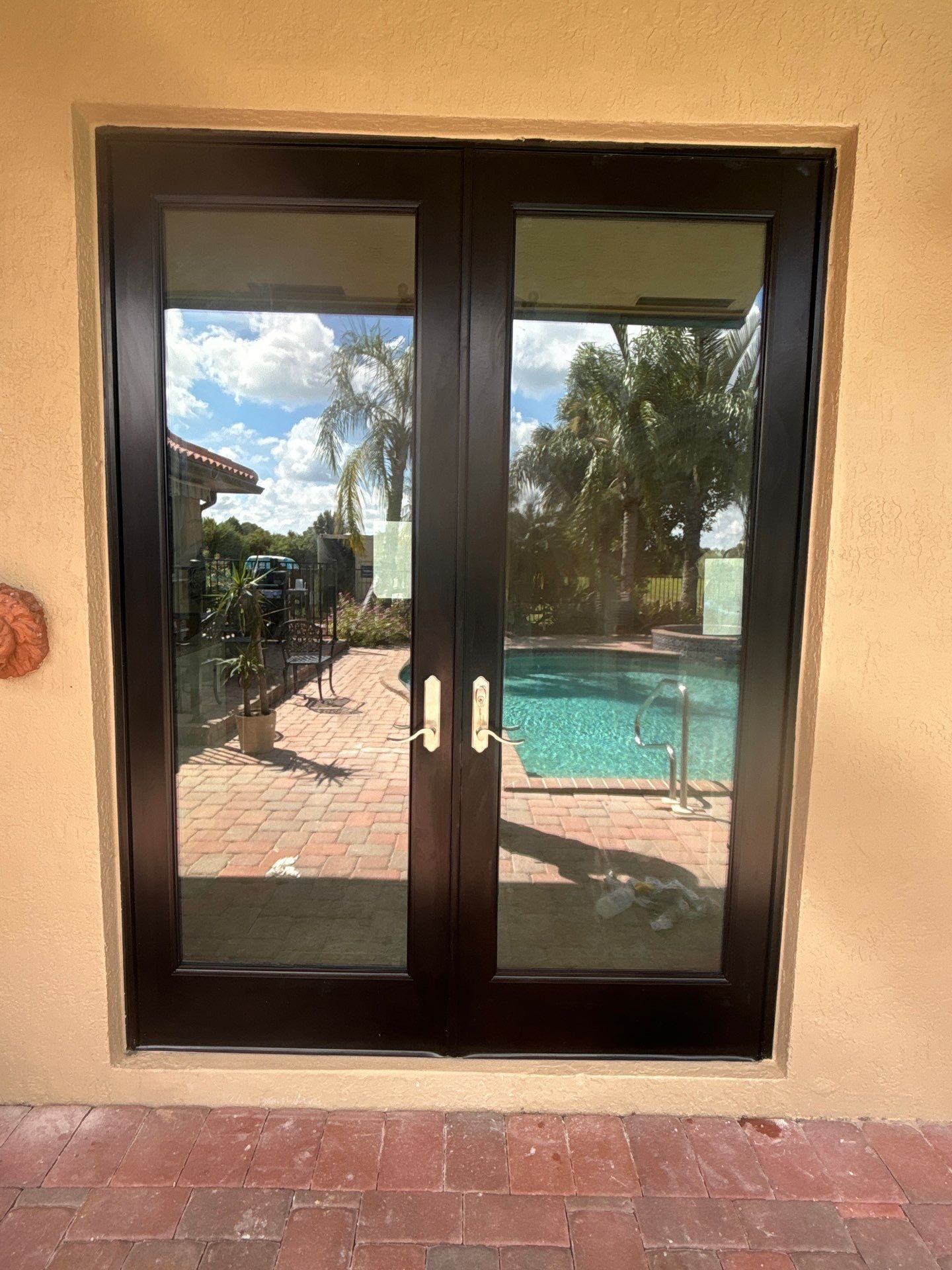 PGT Black pocket doors and Euro-Wall storefront & SGD by Windows For Life 