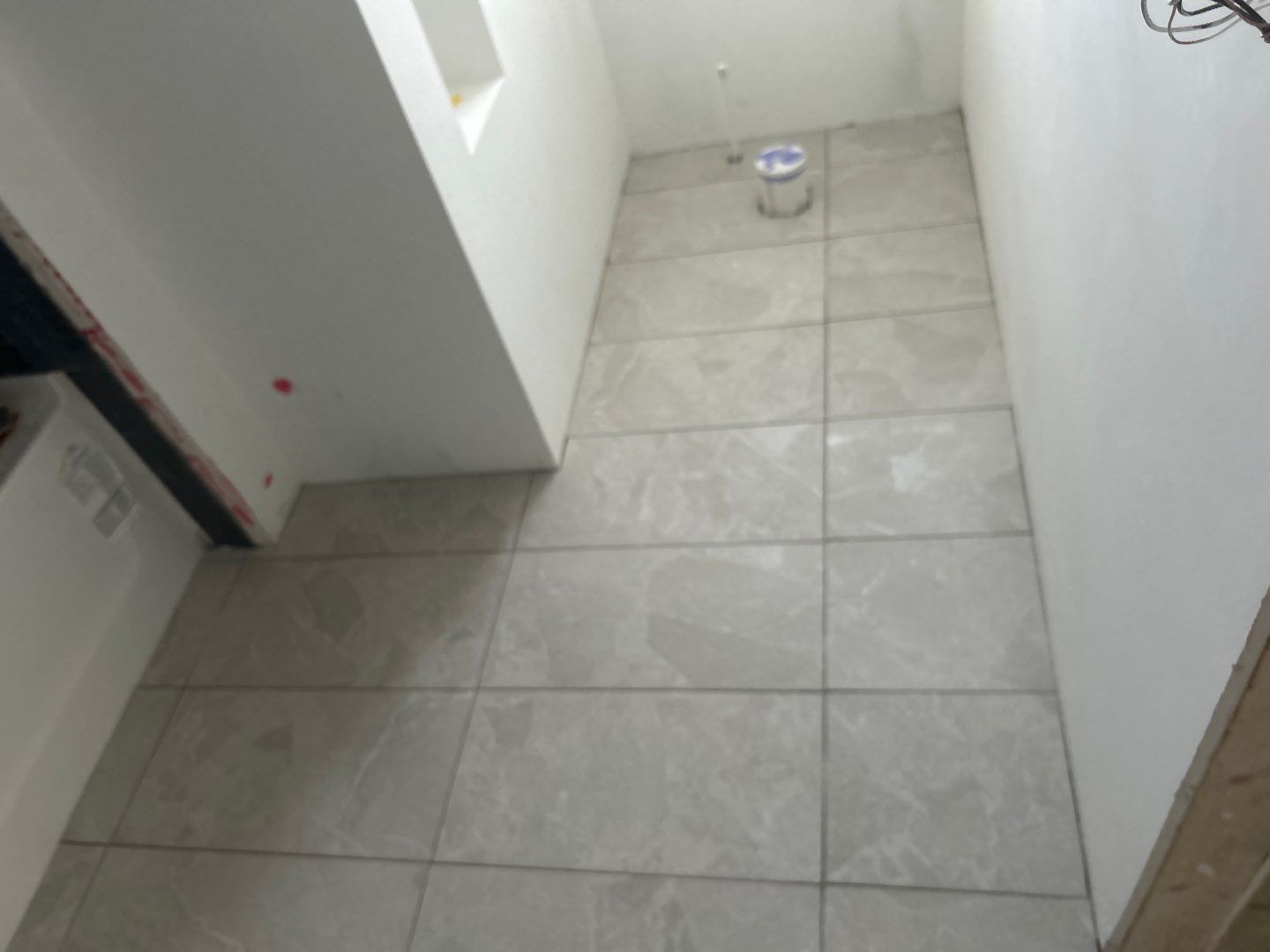 Tile floors, walls, showers, and accent wall for bathrooms  by Footprints Floors of Nashville