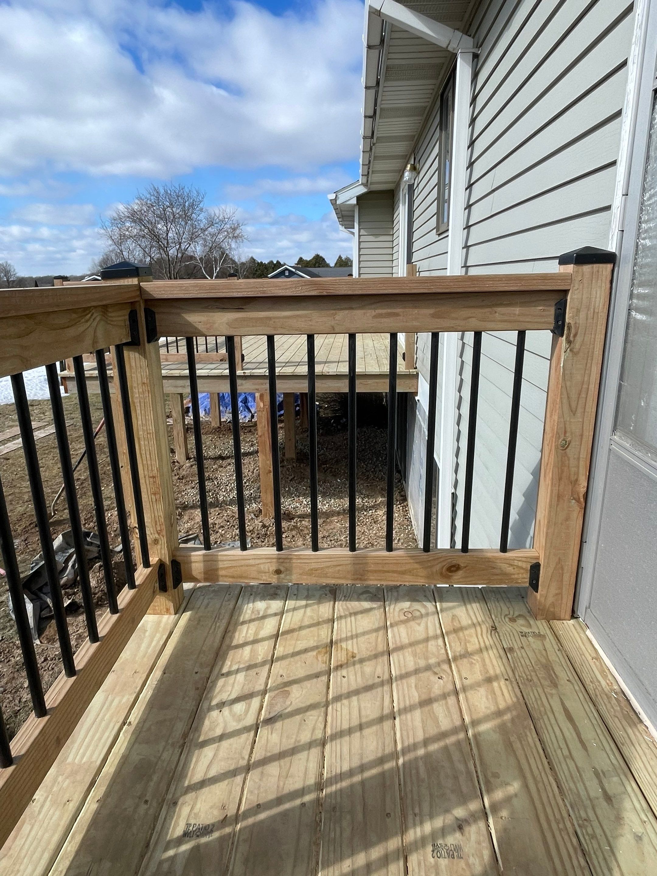 Deck Installation using Treated Lumber by Avalon Roofing and Exteriors