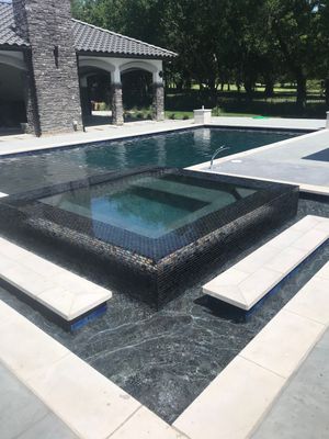 Modern Geometric Pool with Raised Spa and Glass Tile