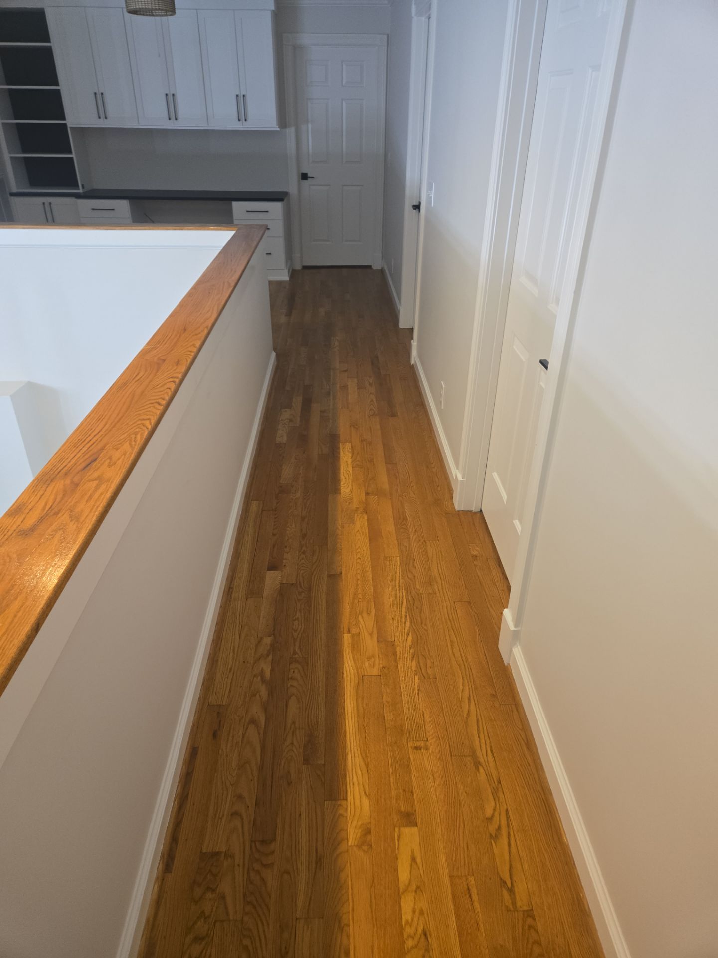 Updated staircase and hallway by Footprints Floors of Nashville