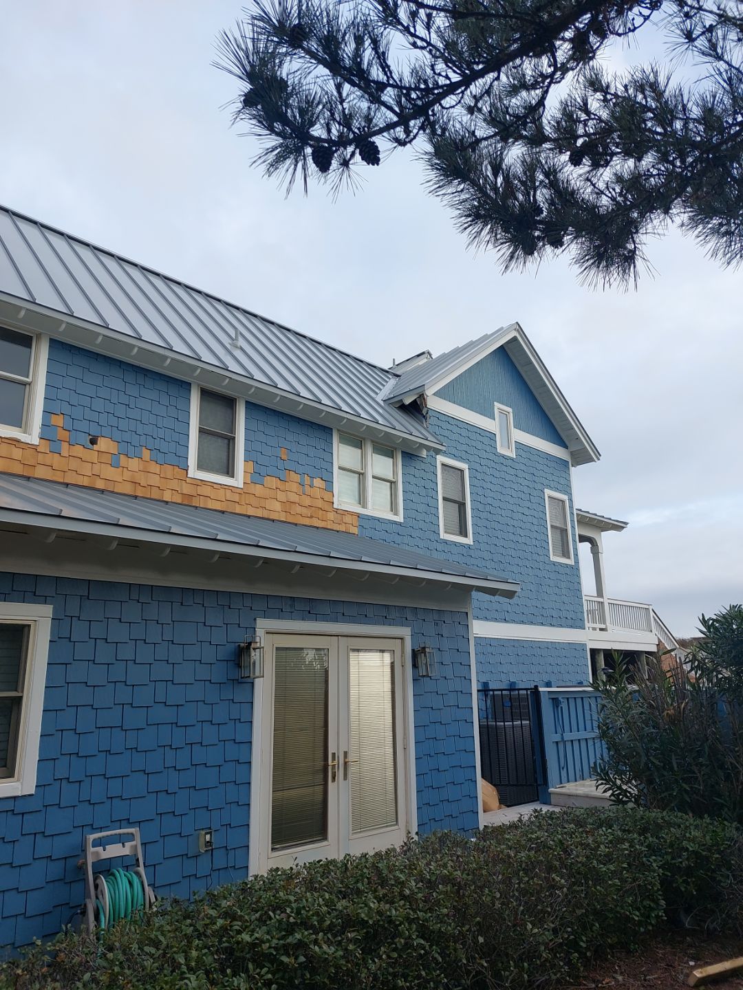 Large Metal Roof Transformation by Gallop Roofing & Remodeling, Inc.