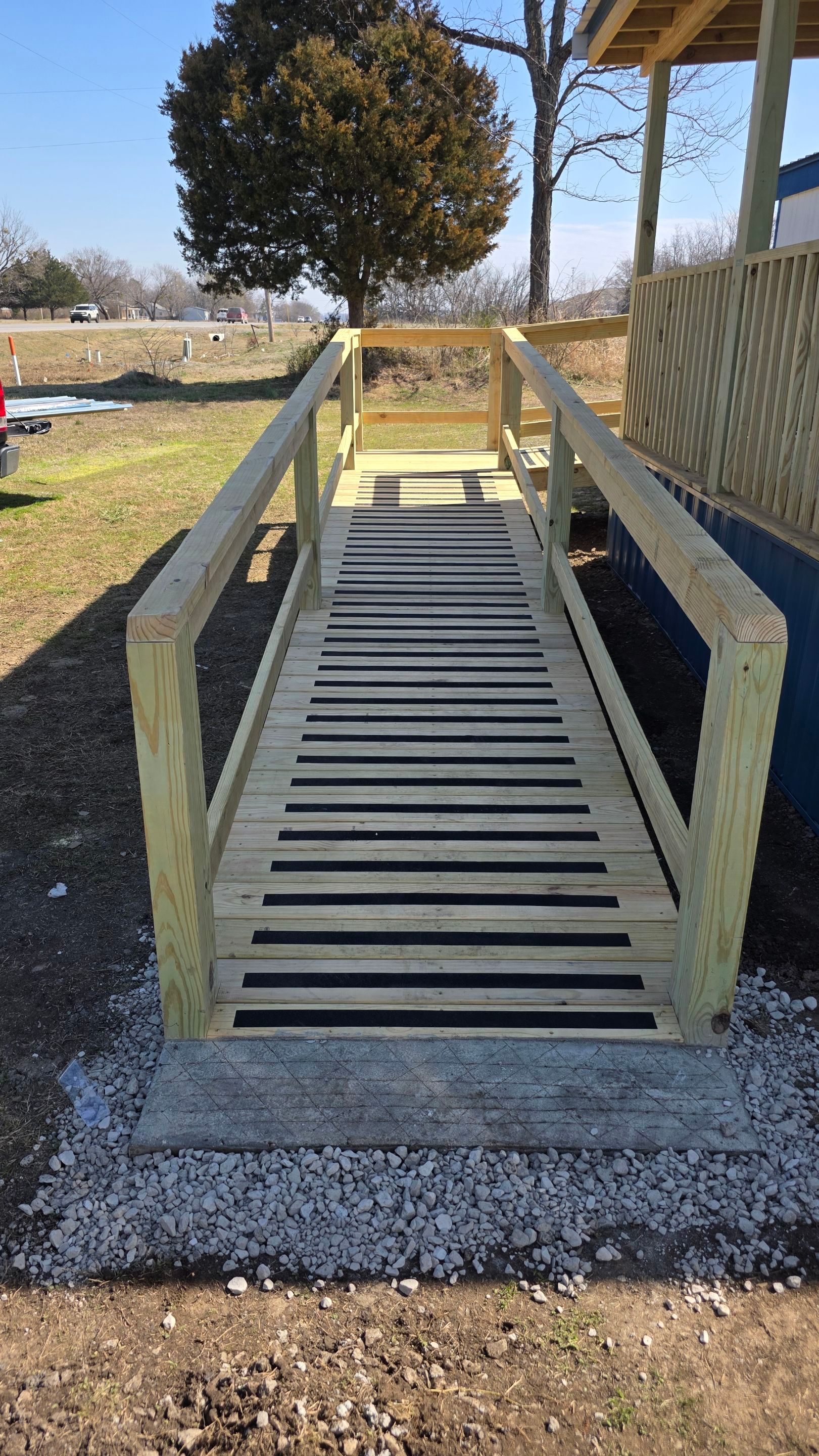 Covered Deck w/ ADA Ramp by In & Out Construction & Remodeling, LLC