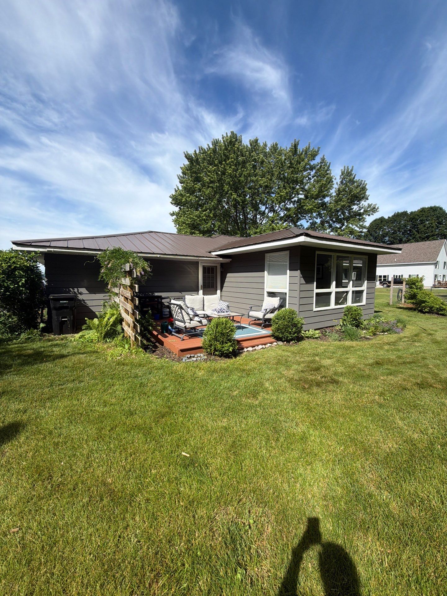 Gutter Installation for Onekama Residence With Metal Roofing by Rainbow Seamless Systems