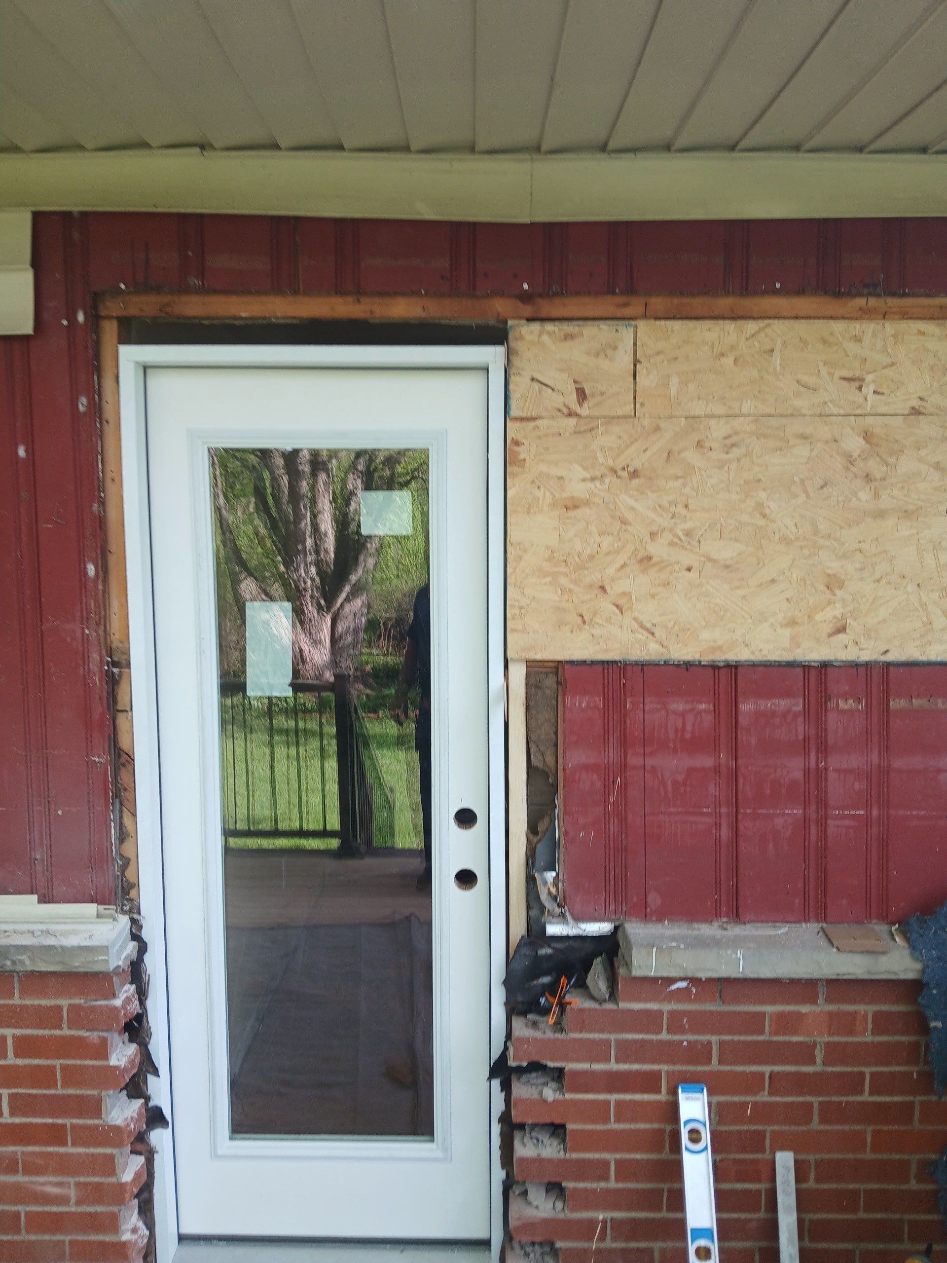 Deck and door install by Cousins Roofing Siding & Decks