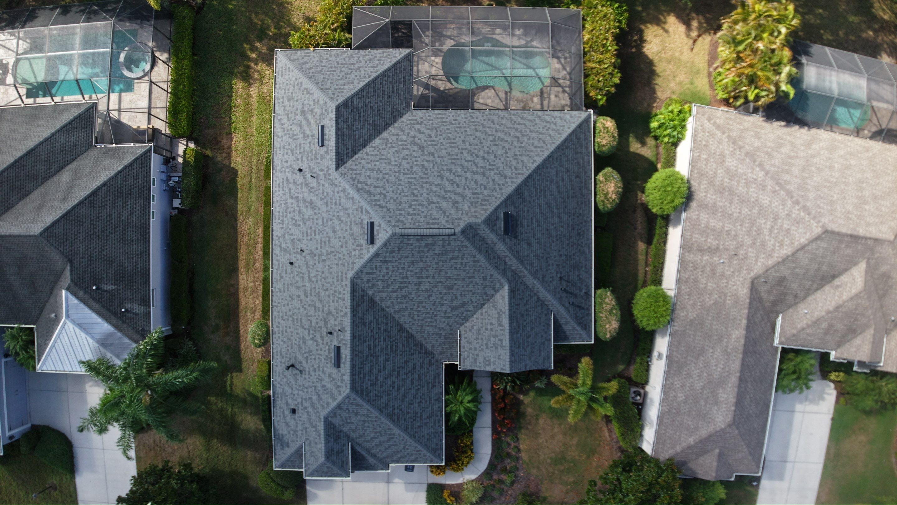 Residential Roof Installation With Estate Grey Architectural Shingles in Bradenton by Trinity Restoration and Roofing LLC