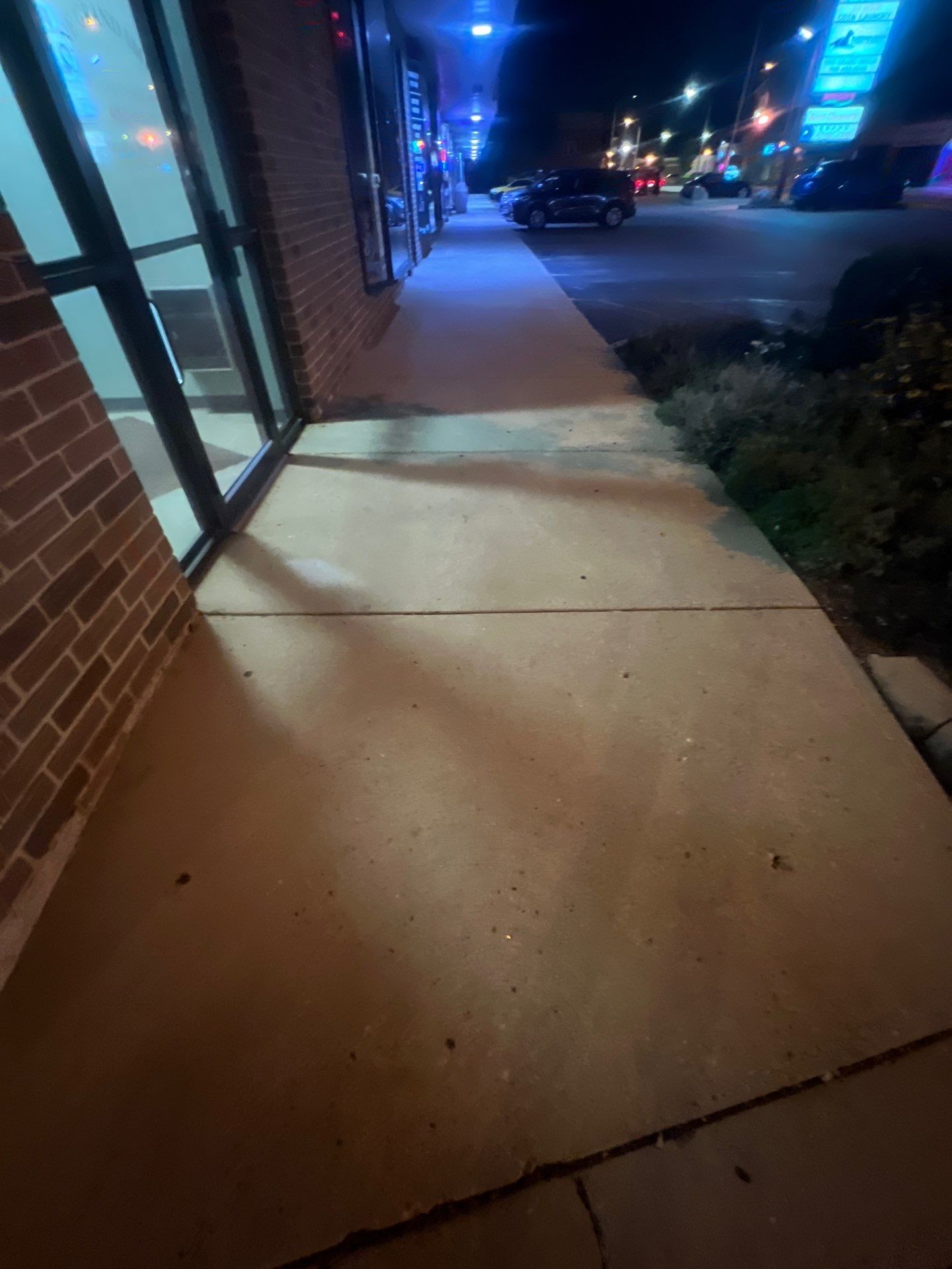 Commercial sidewalk cleaning. by Northern Power Washing LLC.