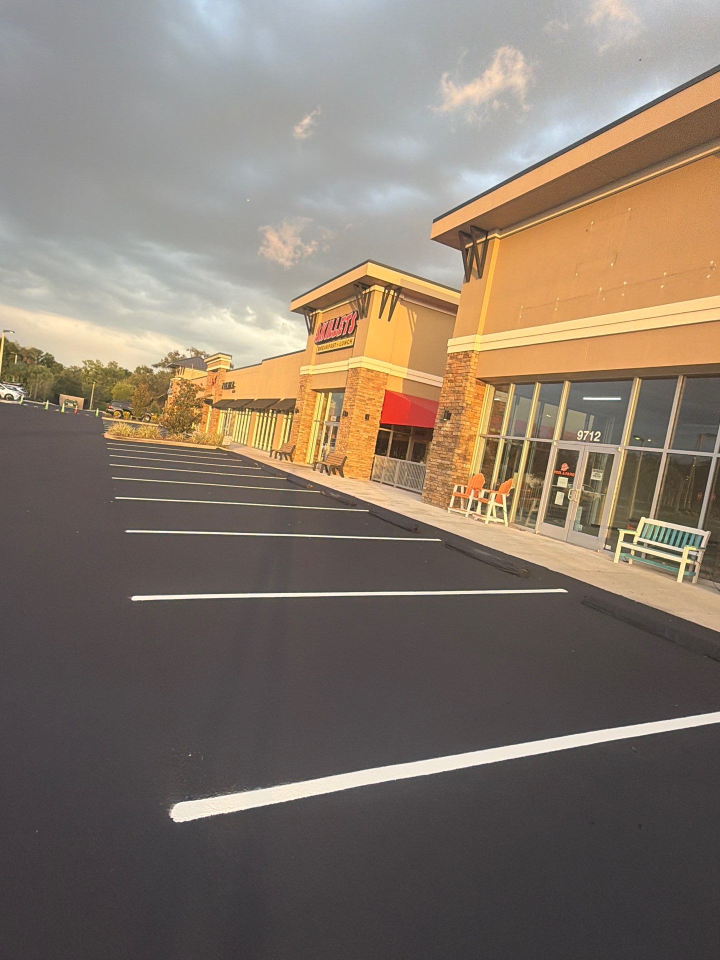 Commercial Asphalt Sealcoating and Line Striping at School House Plaza by Everline Coatings & Services - Southwest FL